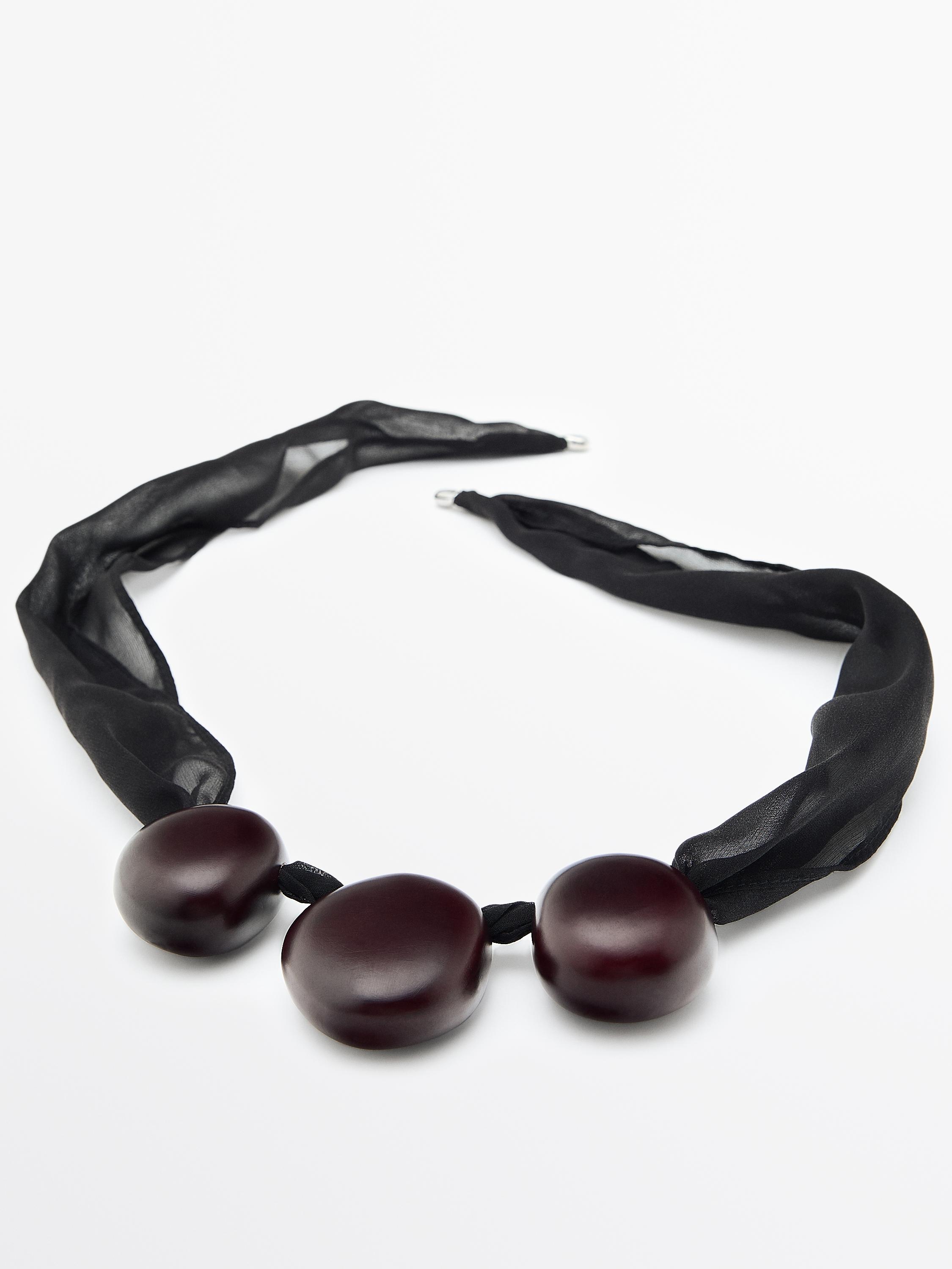 Fabric pendant with wooden beads