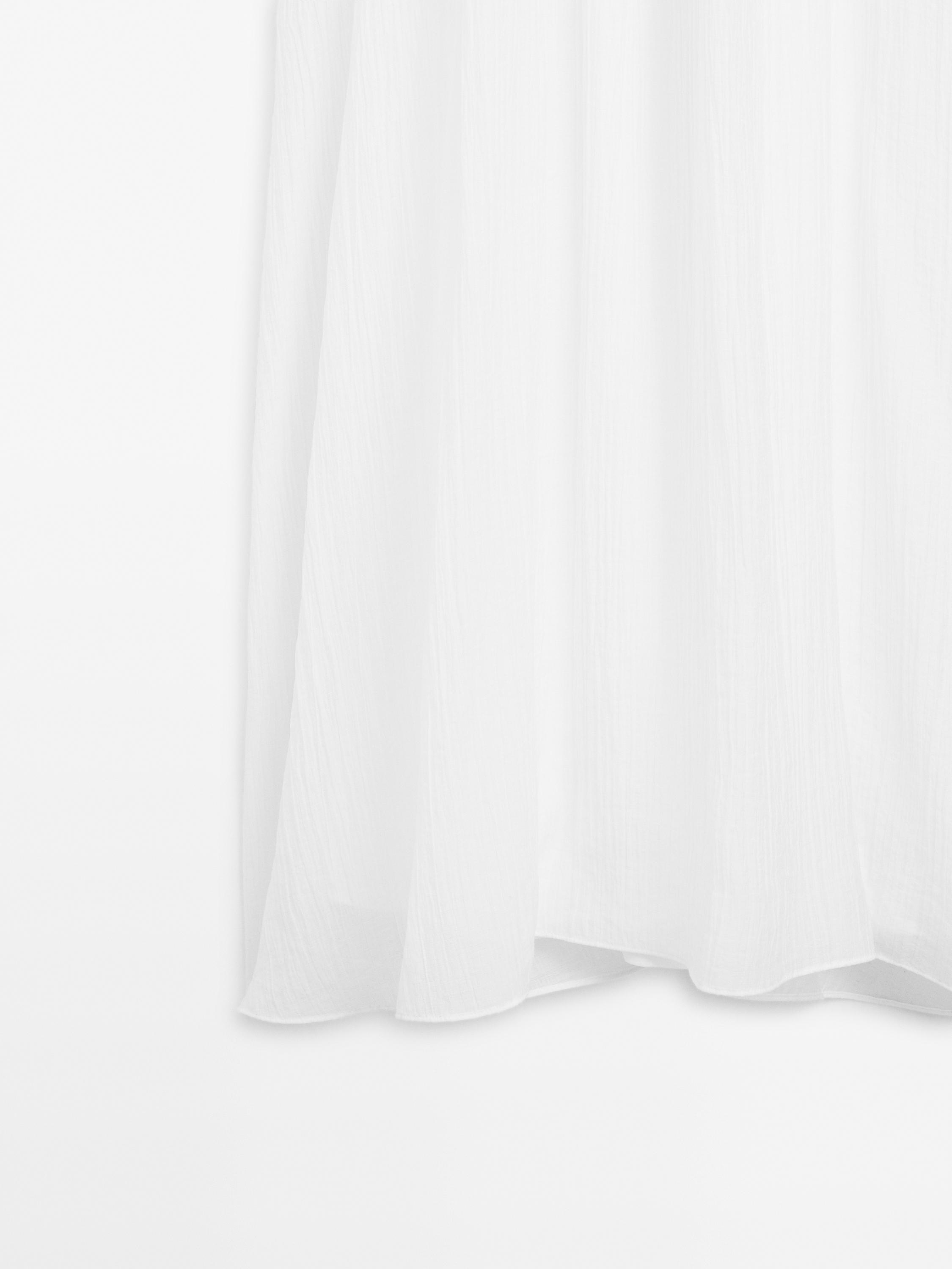 Long pleated dress with gathered detail
