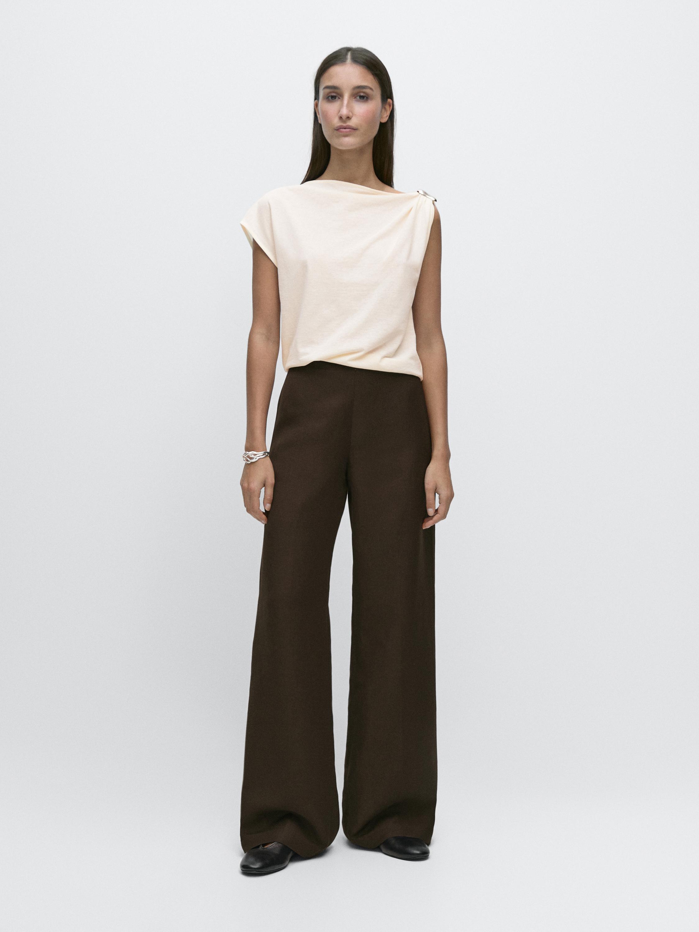 Asymmetric top with shoulder appliqué