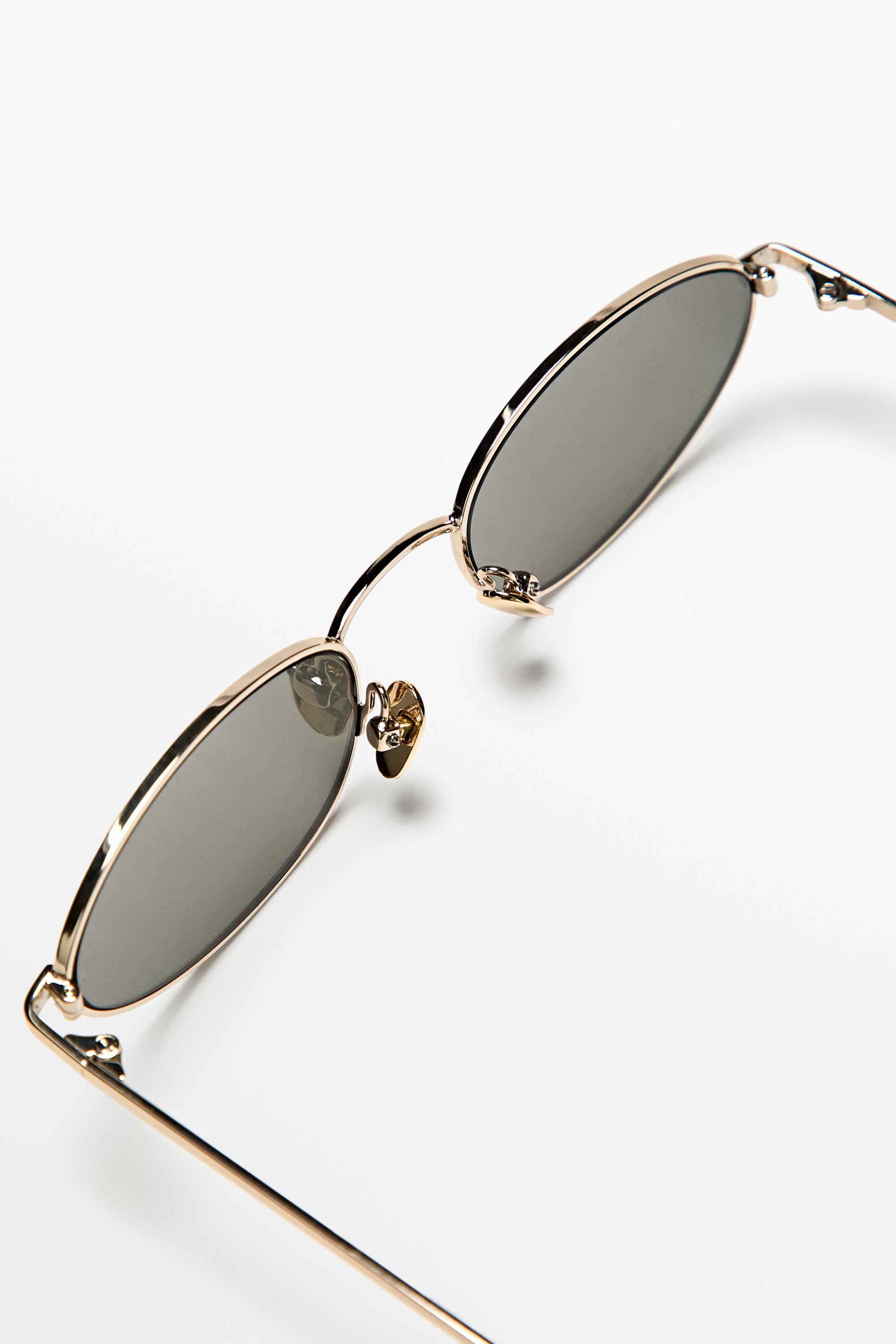Oval metal sunglasses — GOLDEN