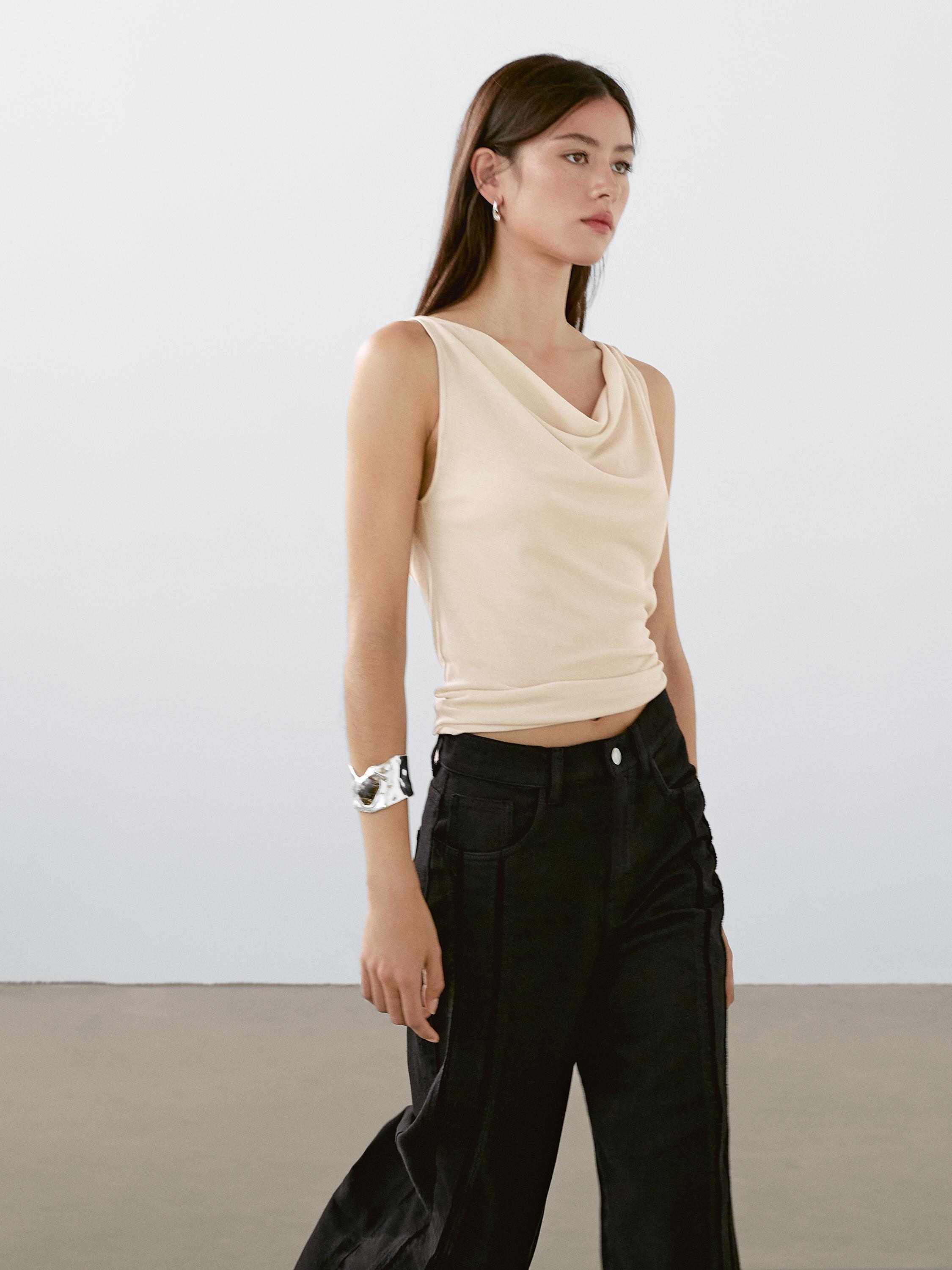 Sleeveless top with draped neckline