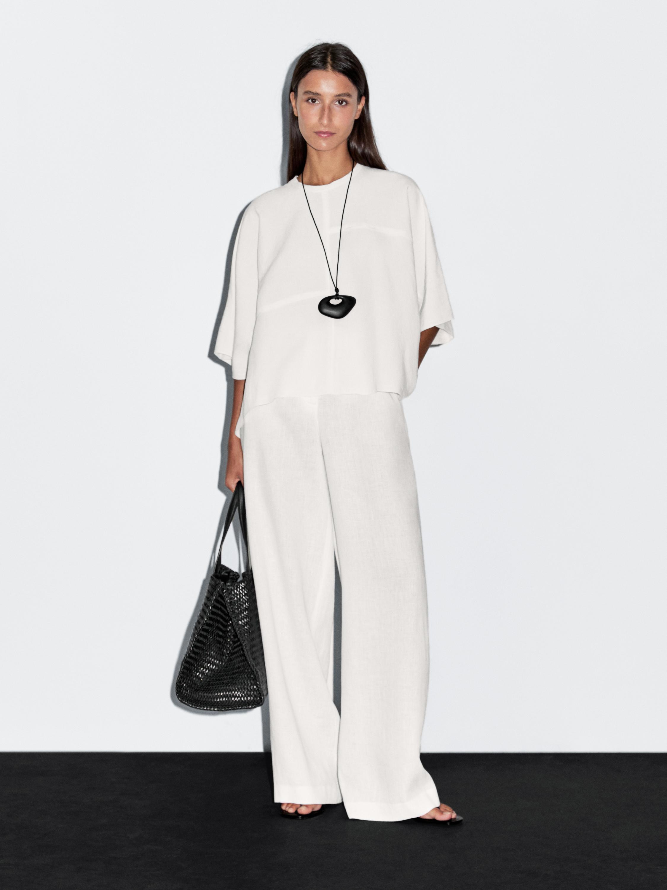 Korte cape met naaddetails