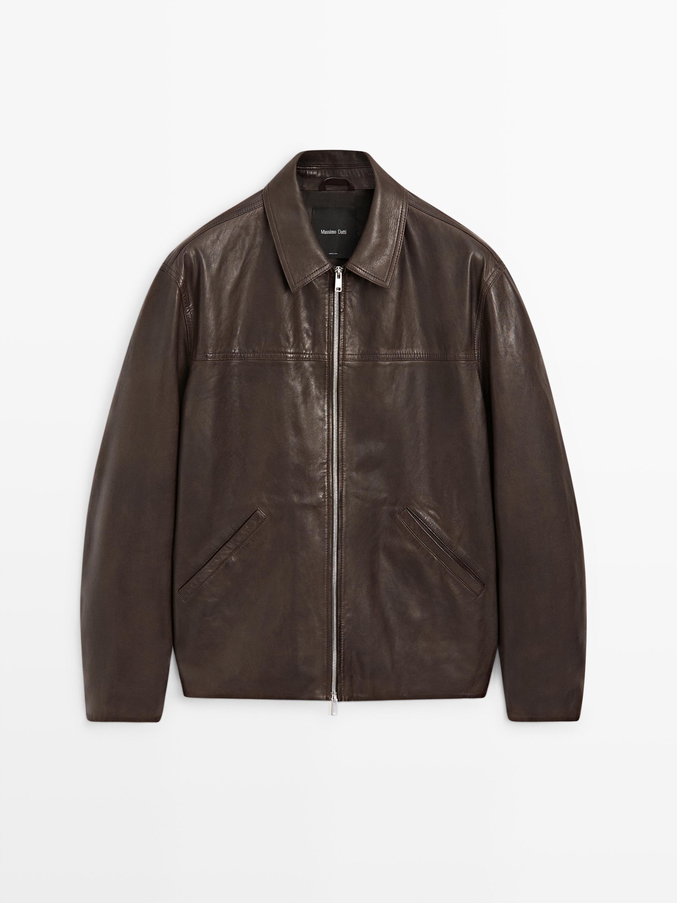 Front view of a brown jacket with a central zipper and slanted side pockets. Classic collar and straight cut.