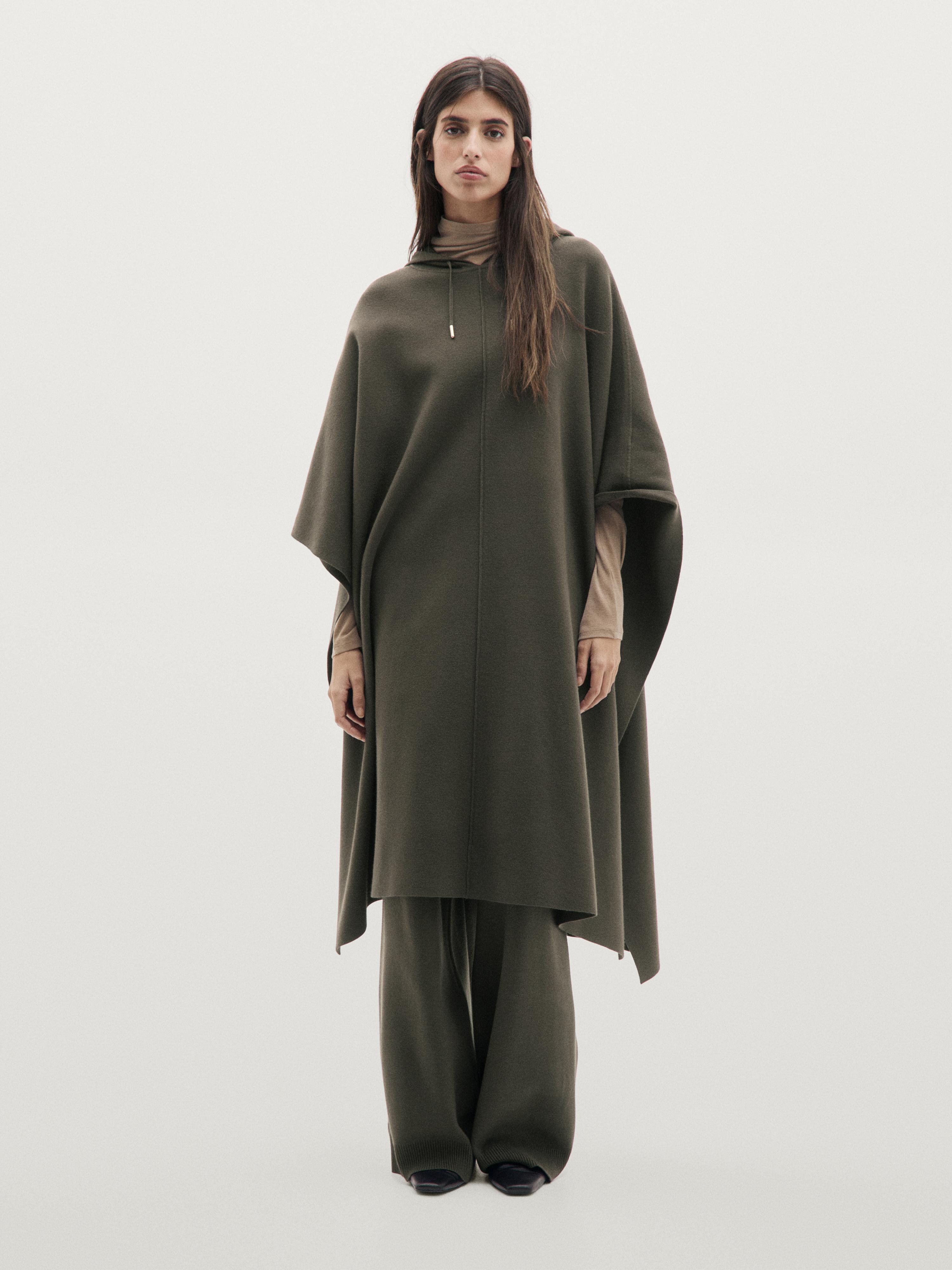 Long knit cape with adjustable hood