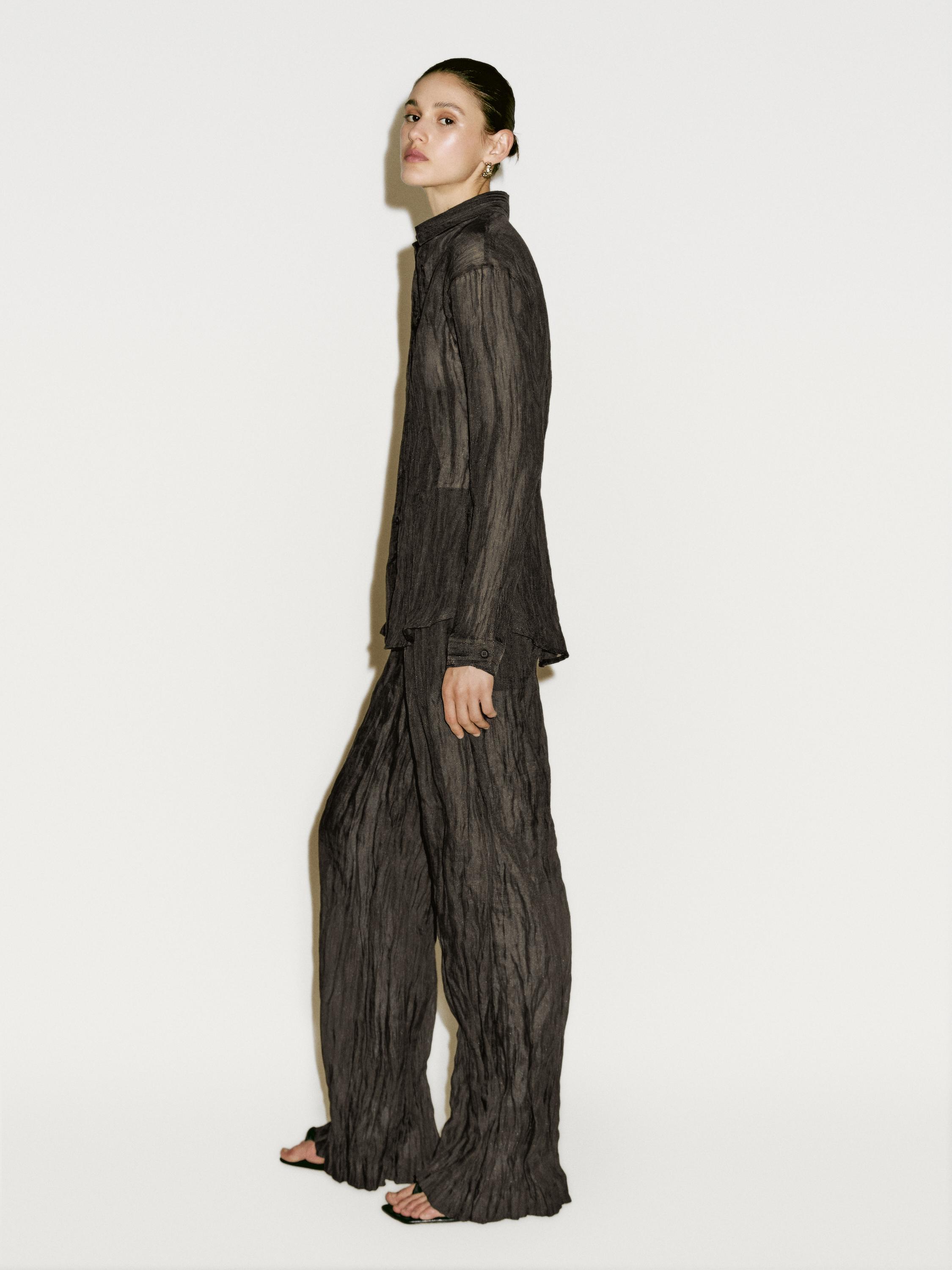 Creased-effect flowing trousers - Limited Edition
