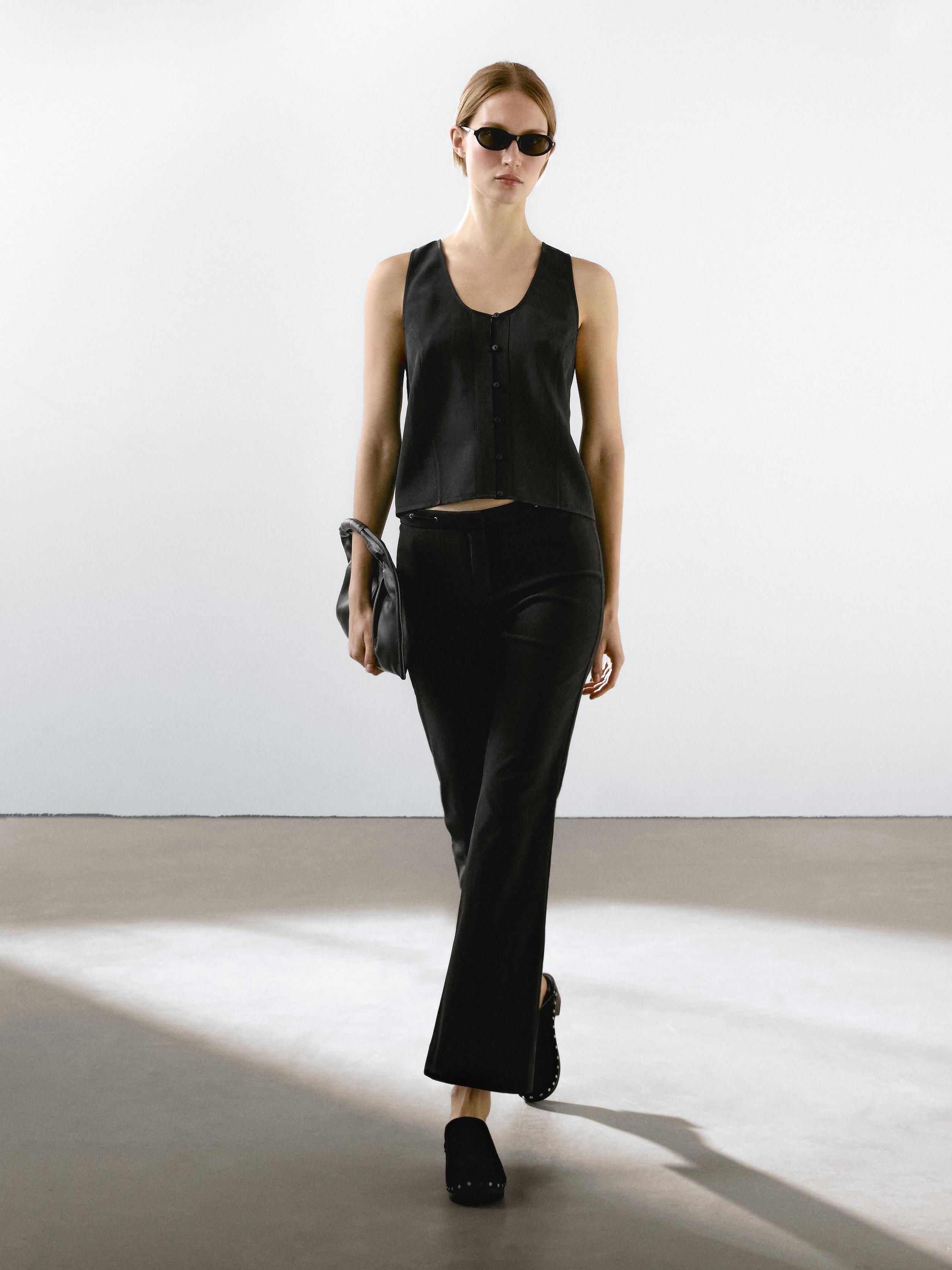 Flared trousers with waist detail