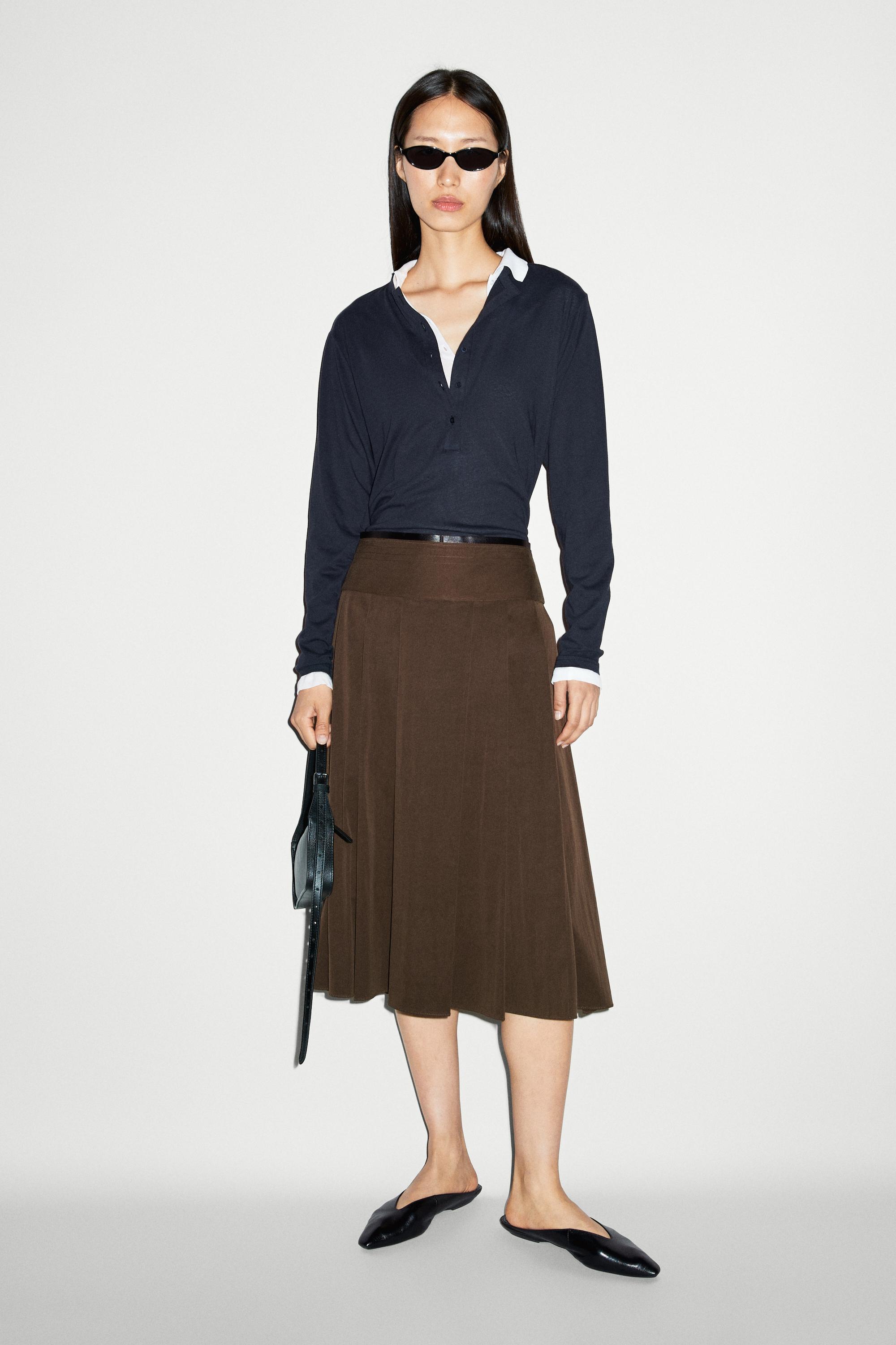Pleated midi skirt with leather detail