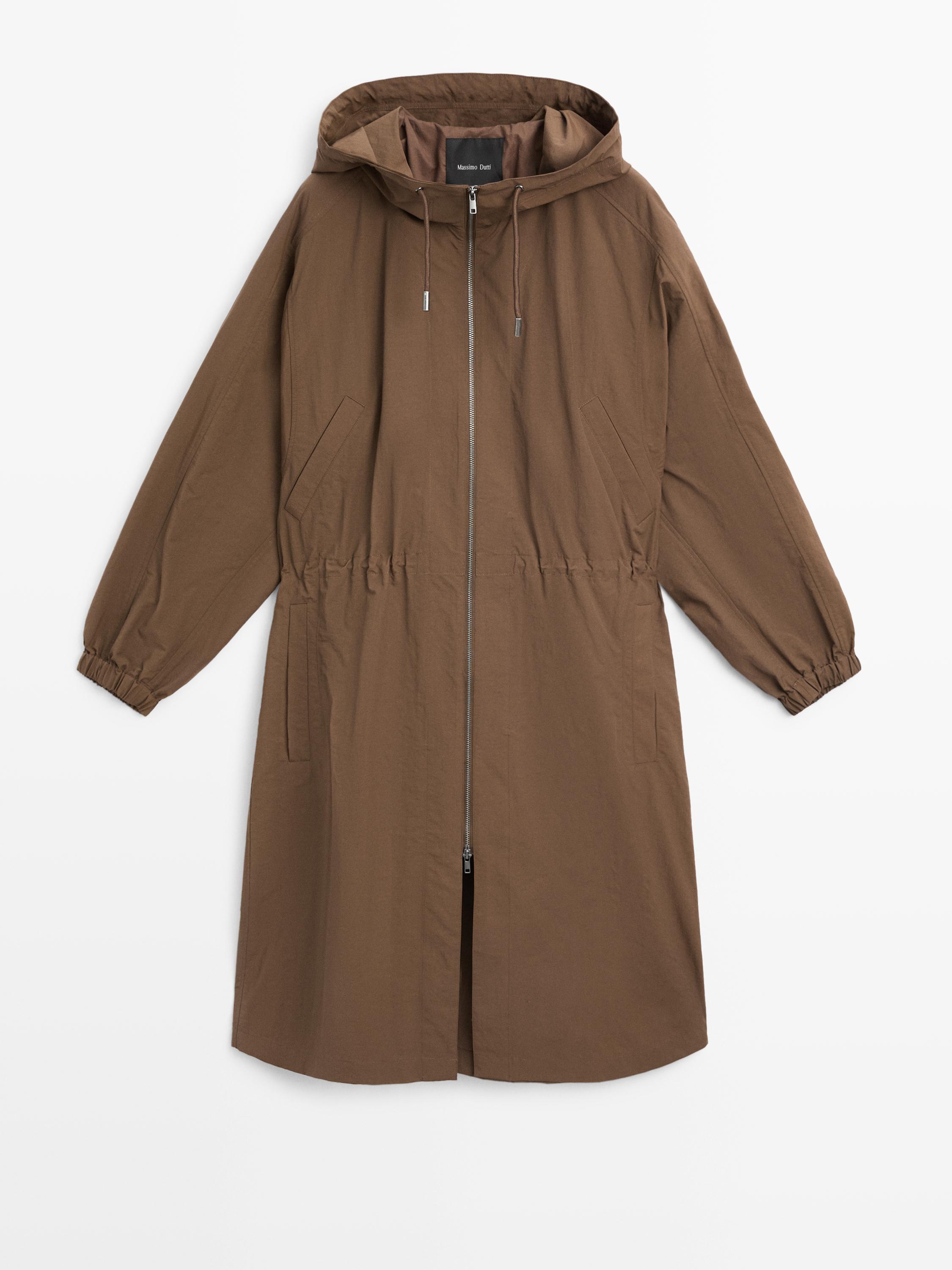 Front view of a long brown parka with a hood, zipper closure, and side pockets.