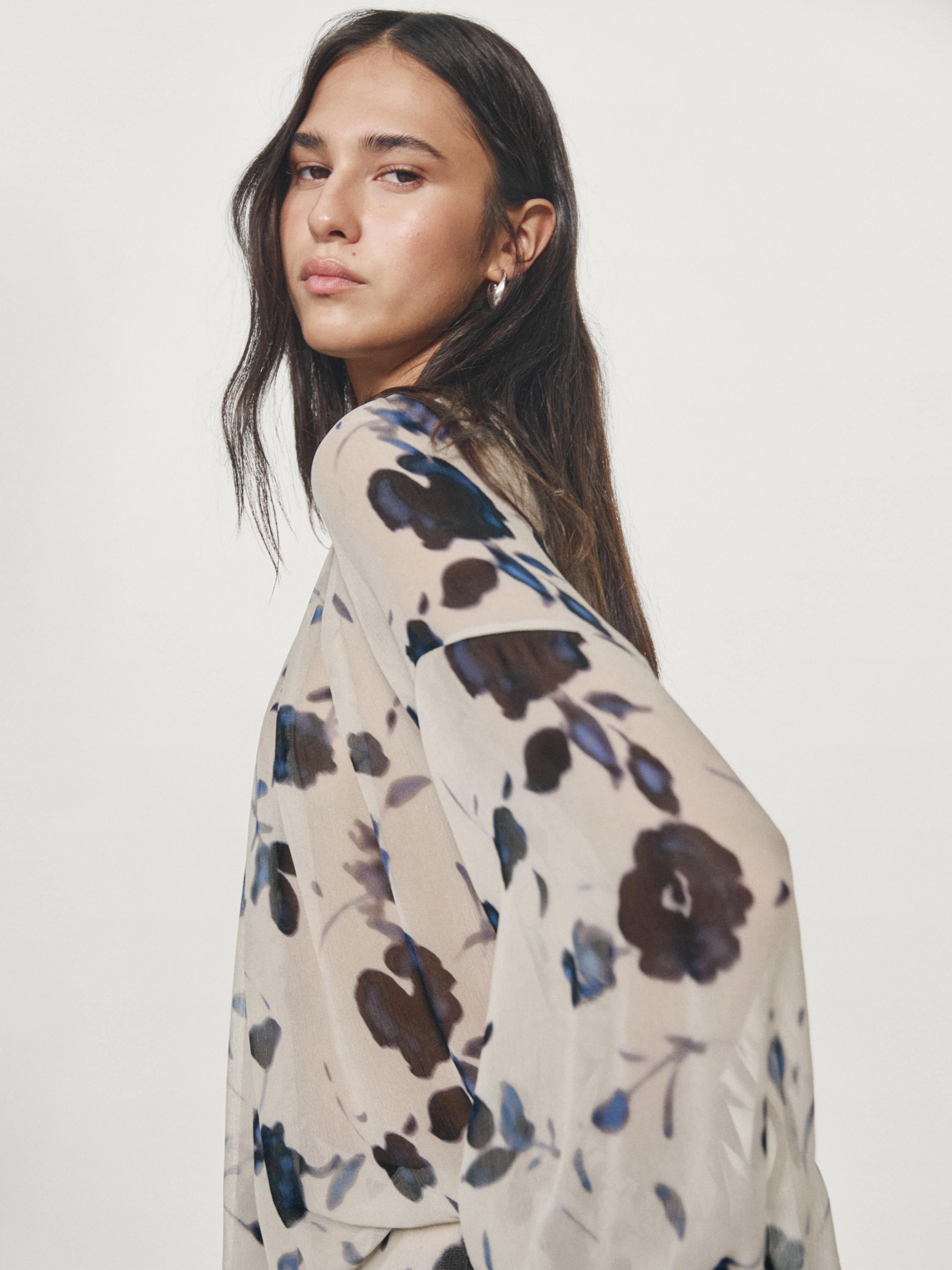 Asymmetric flowing floral print blouse