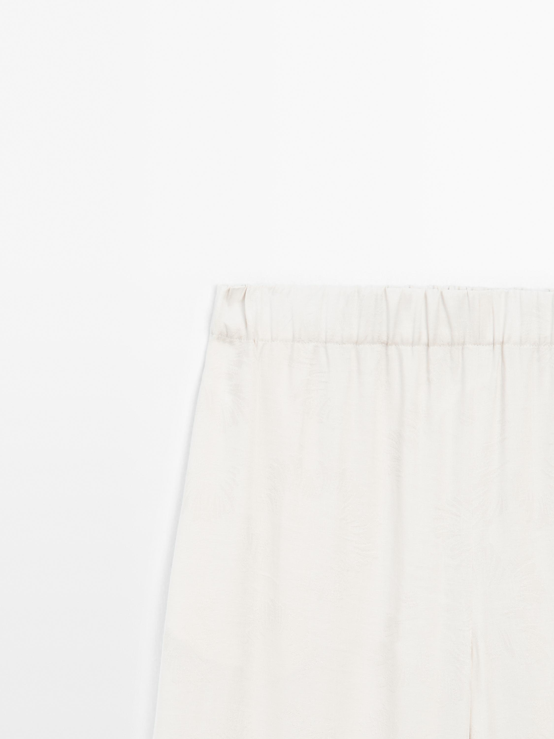 Printed fabric trousers with hem detail