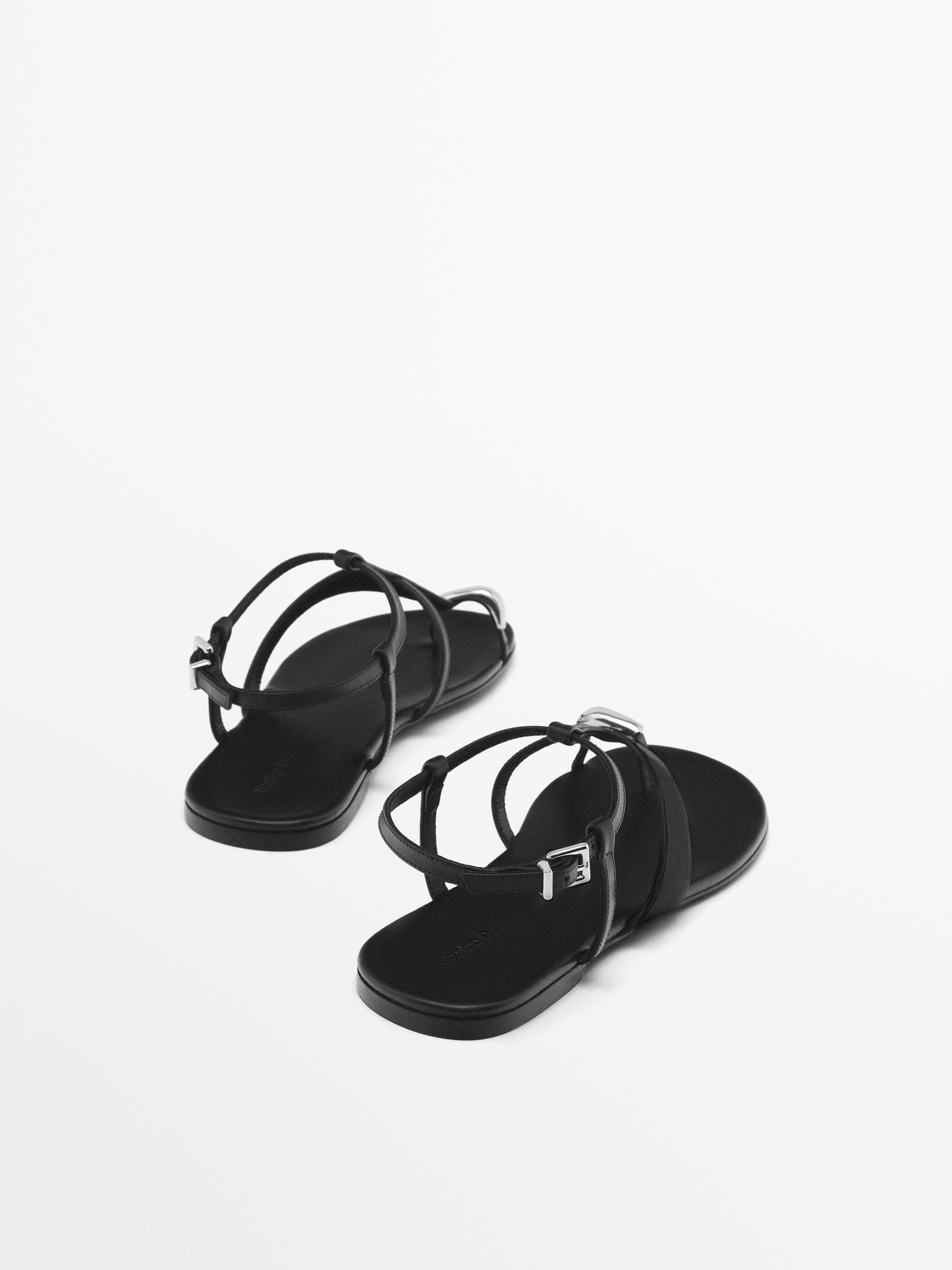 Flat sandals with metallic embellishment
