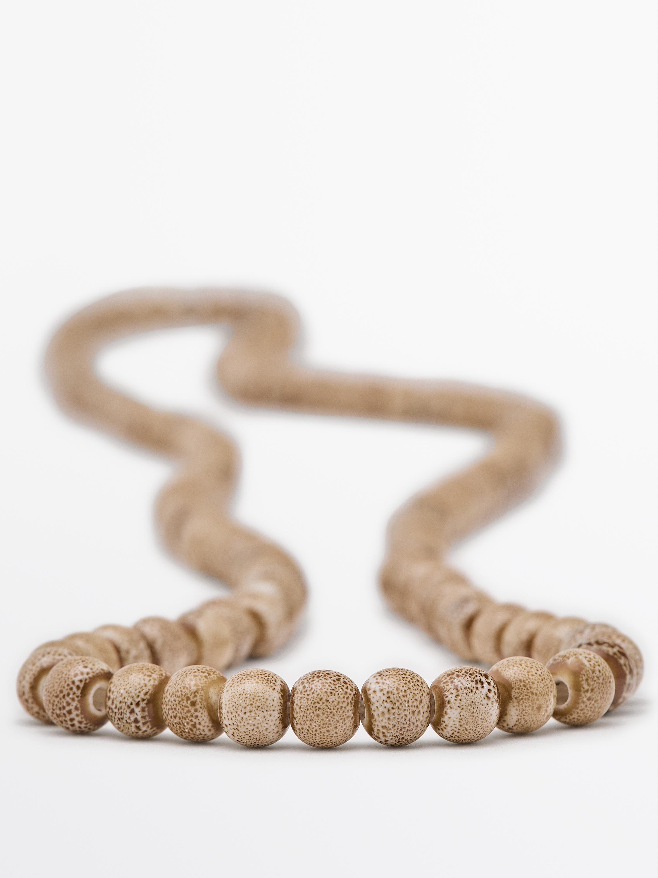 Collier de perles en céramique