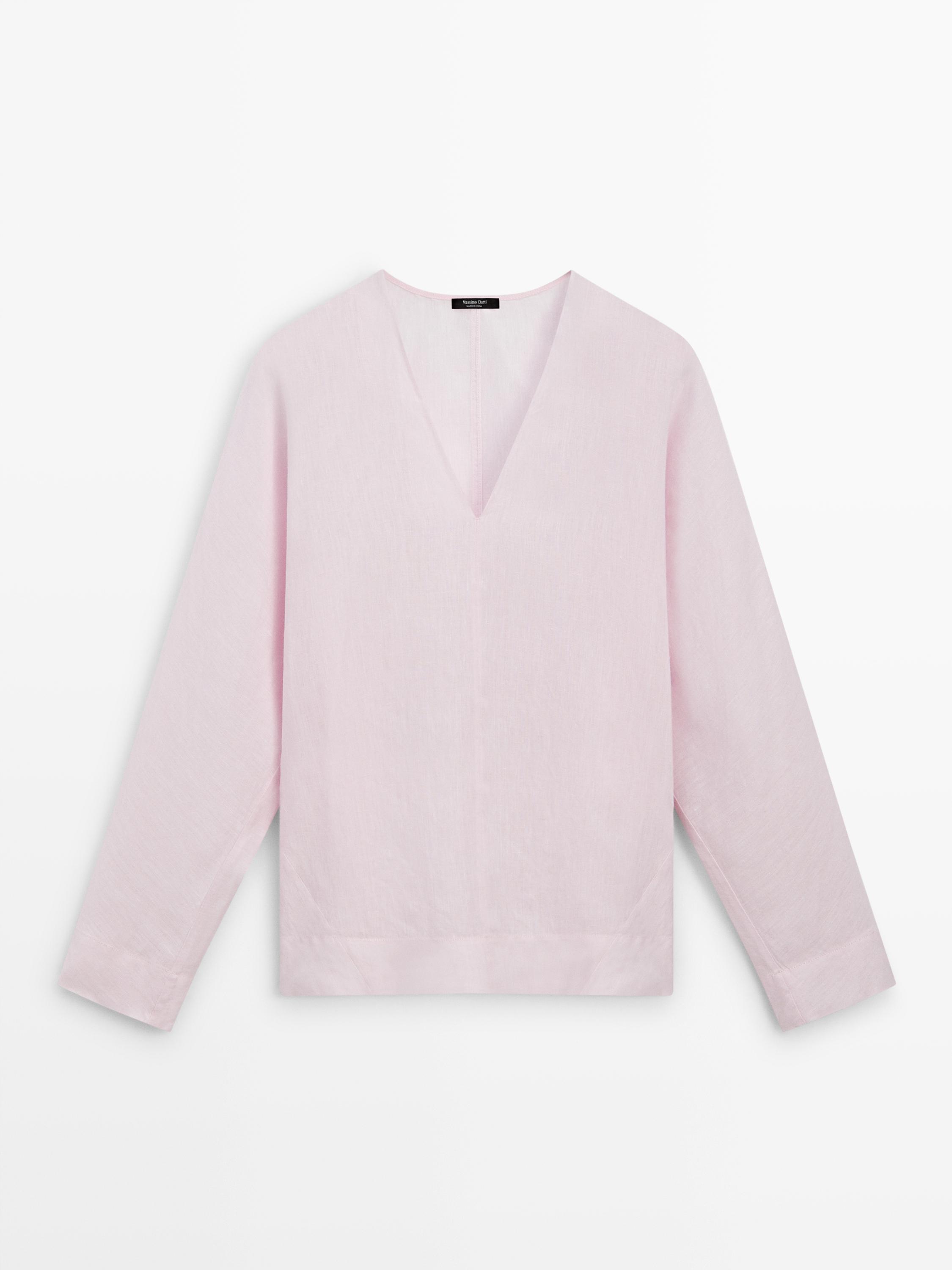 Μπροστινή όψη ροζ μπλούζας με V-λαιμόκοψη και μακριά μανίκια.