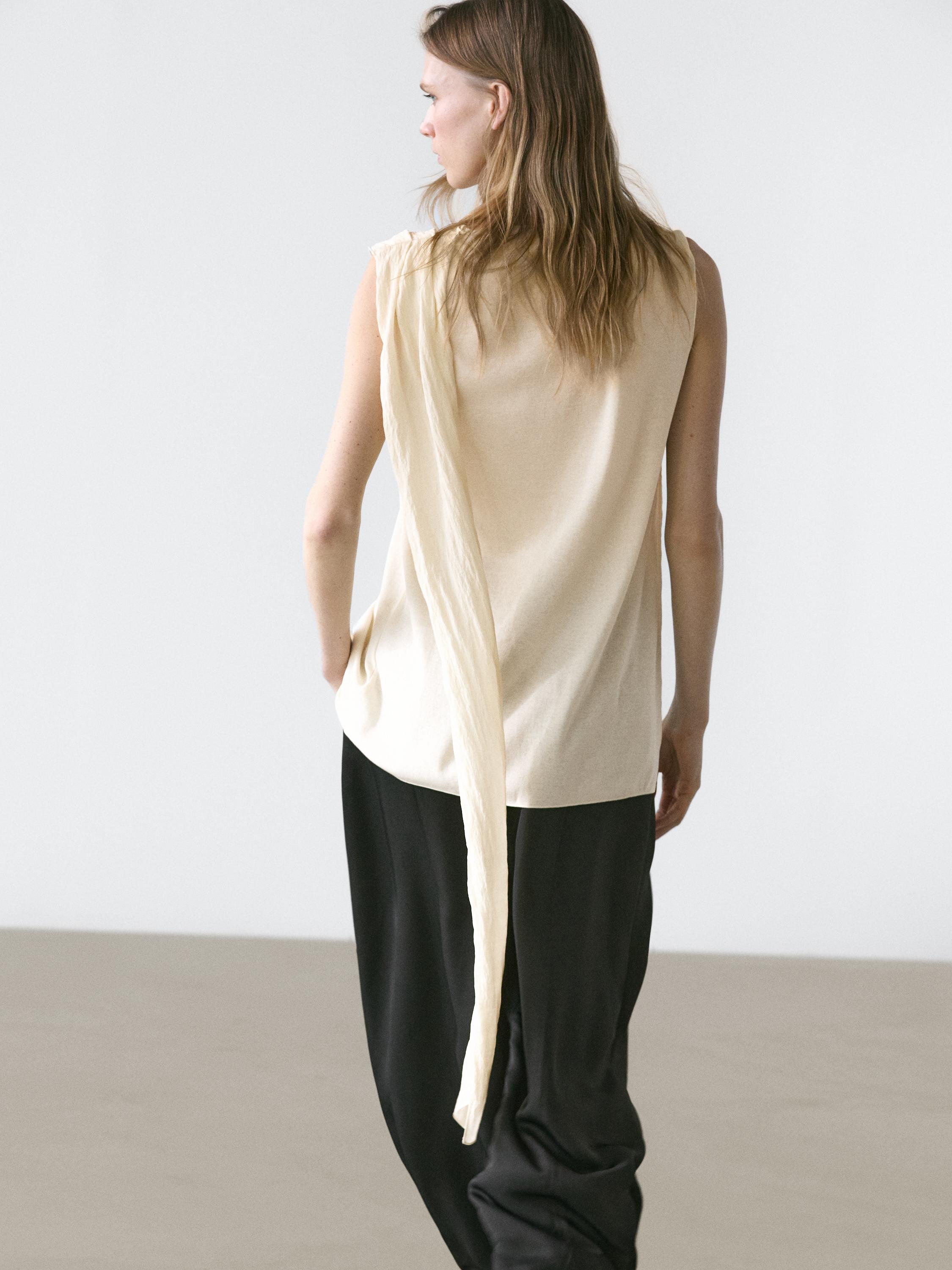 Crossover top with shoulder scarf detail — CREAM