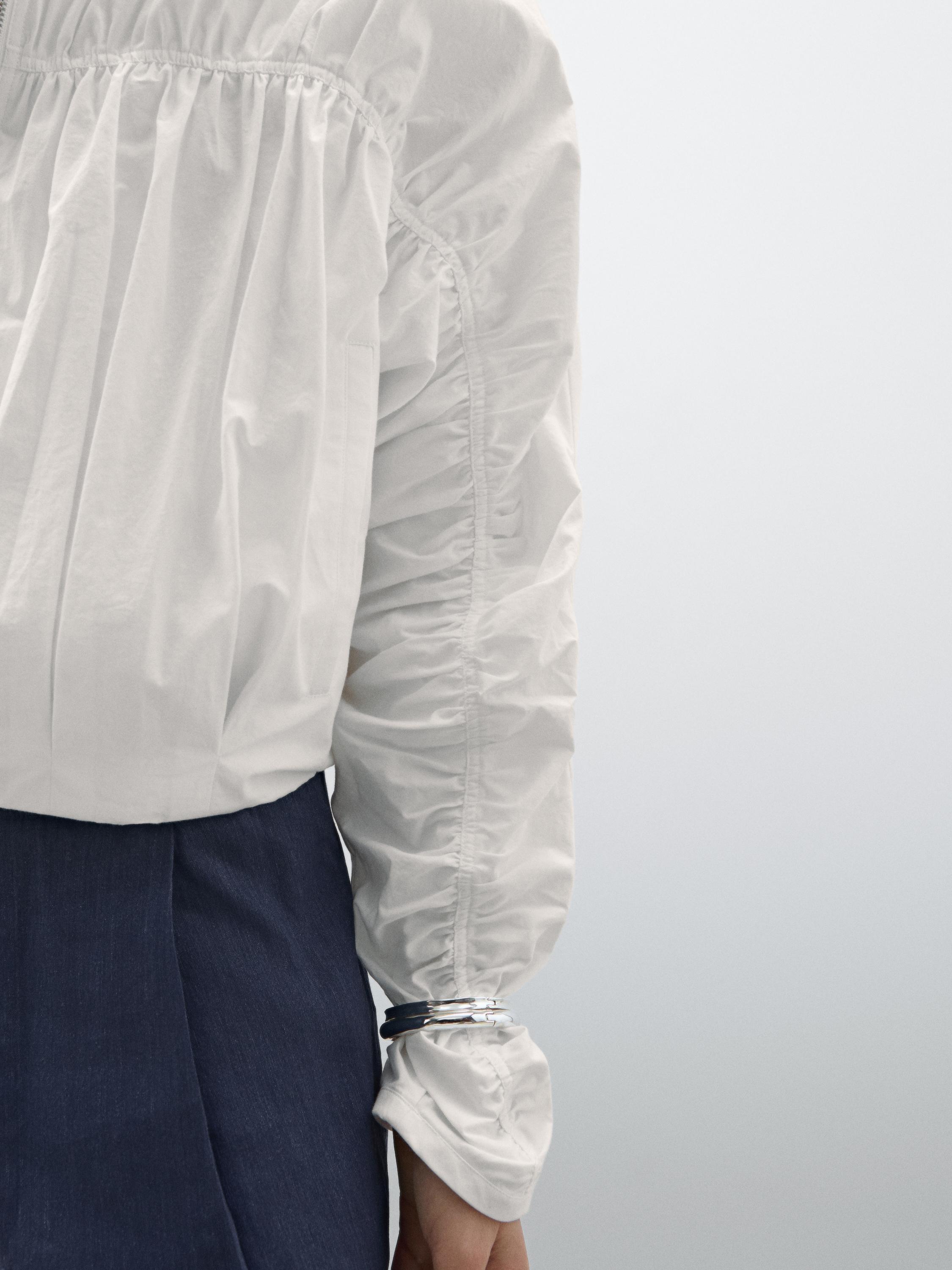 Voluminous bomber jacket with gathered detail