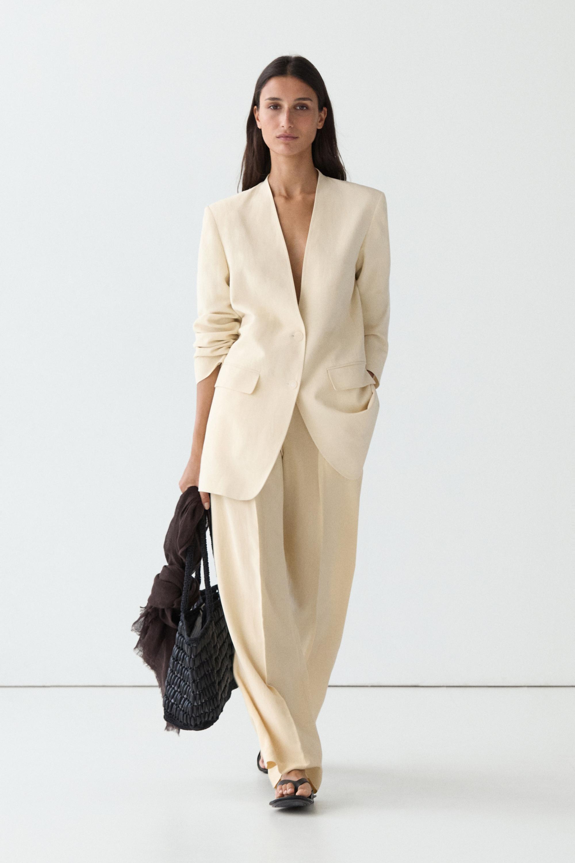 Flowing trousers with pleats — Beige