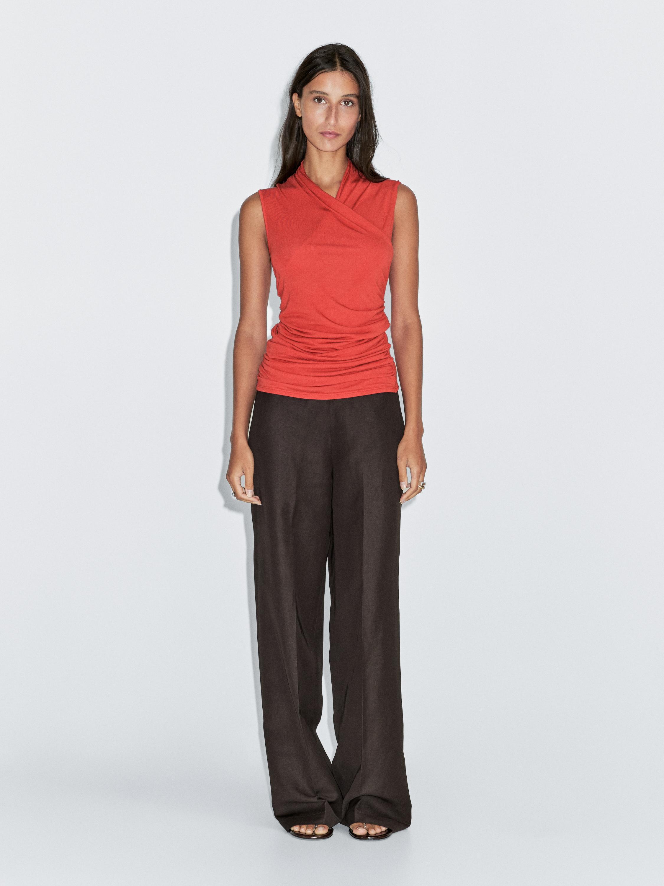 Draped top with surplice neckline