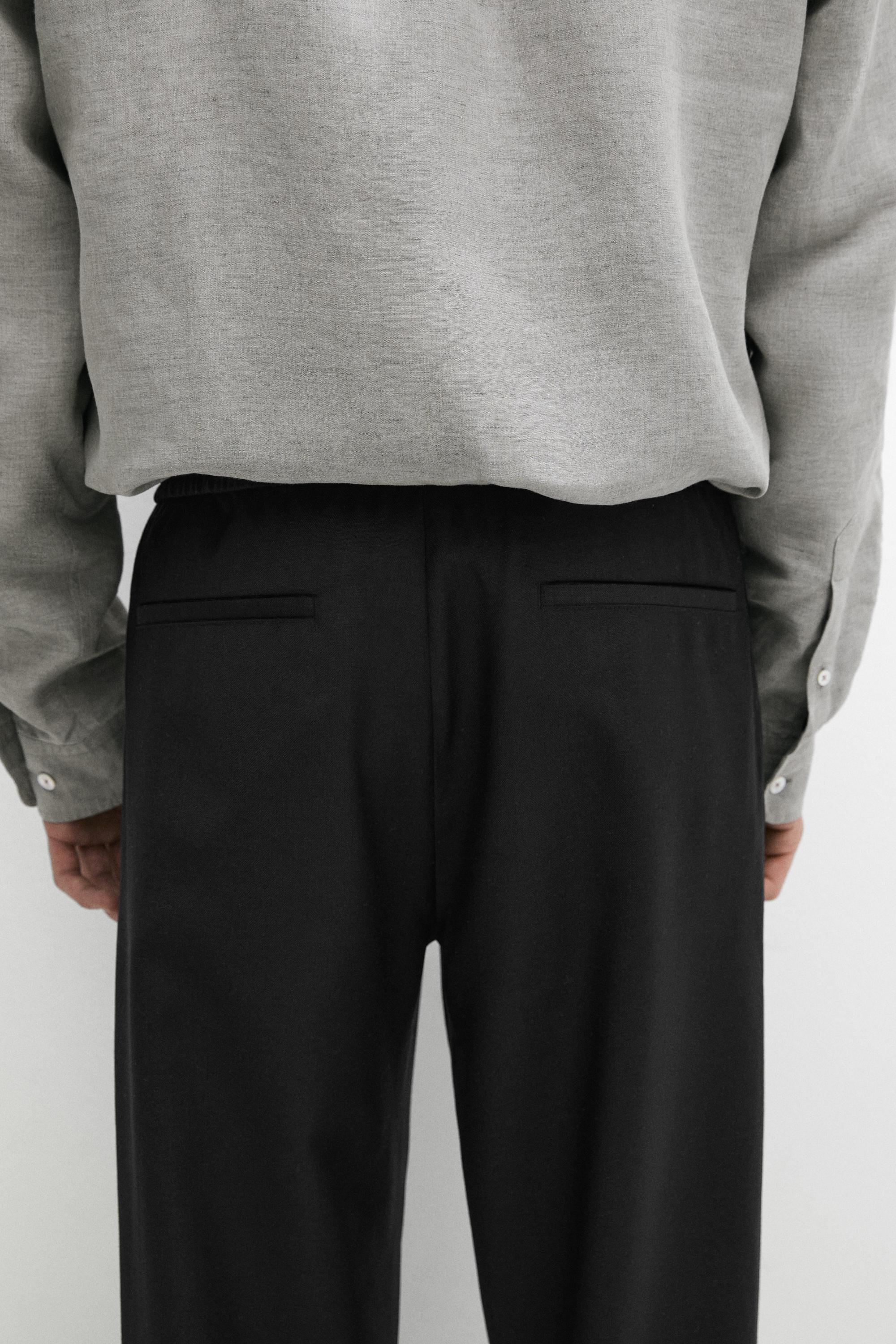 Relaxed fit 100% wool trousers — BLACK