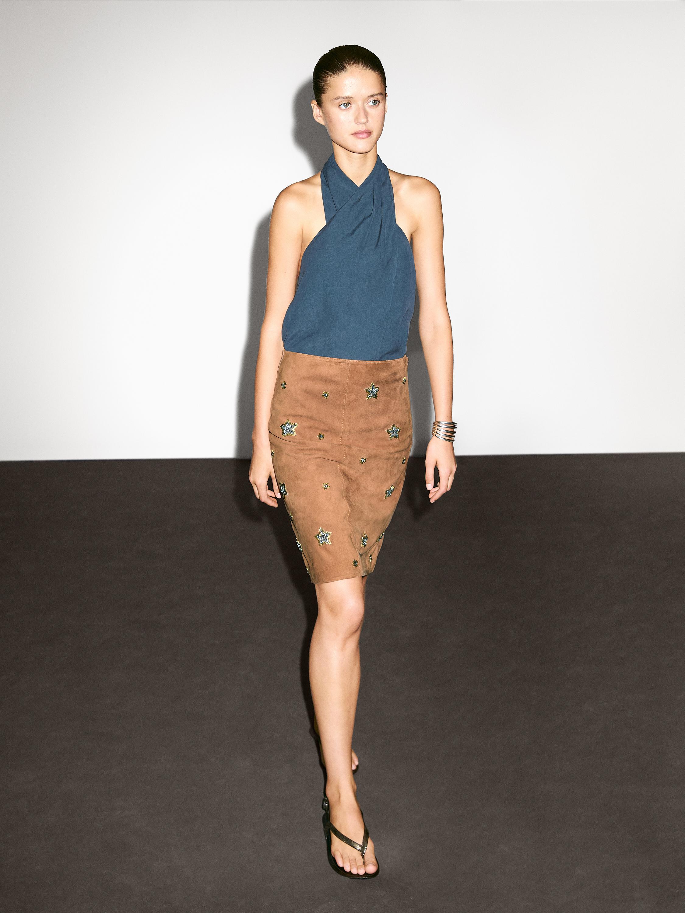 Suede leather skirt with rhinestone detail