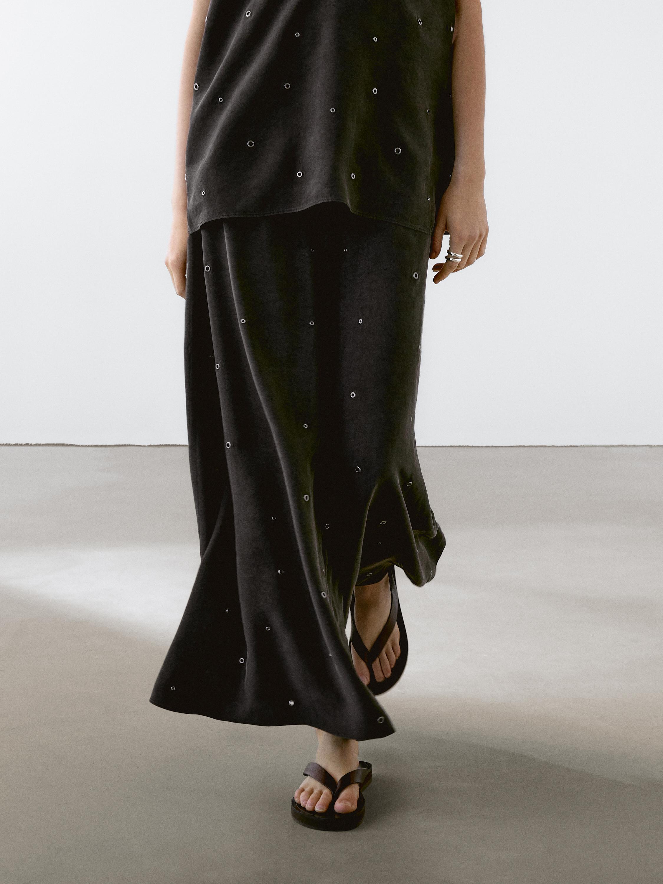 Long skirt with eyelets