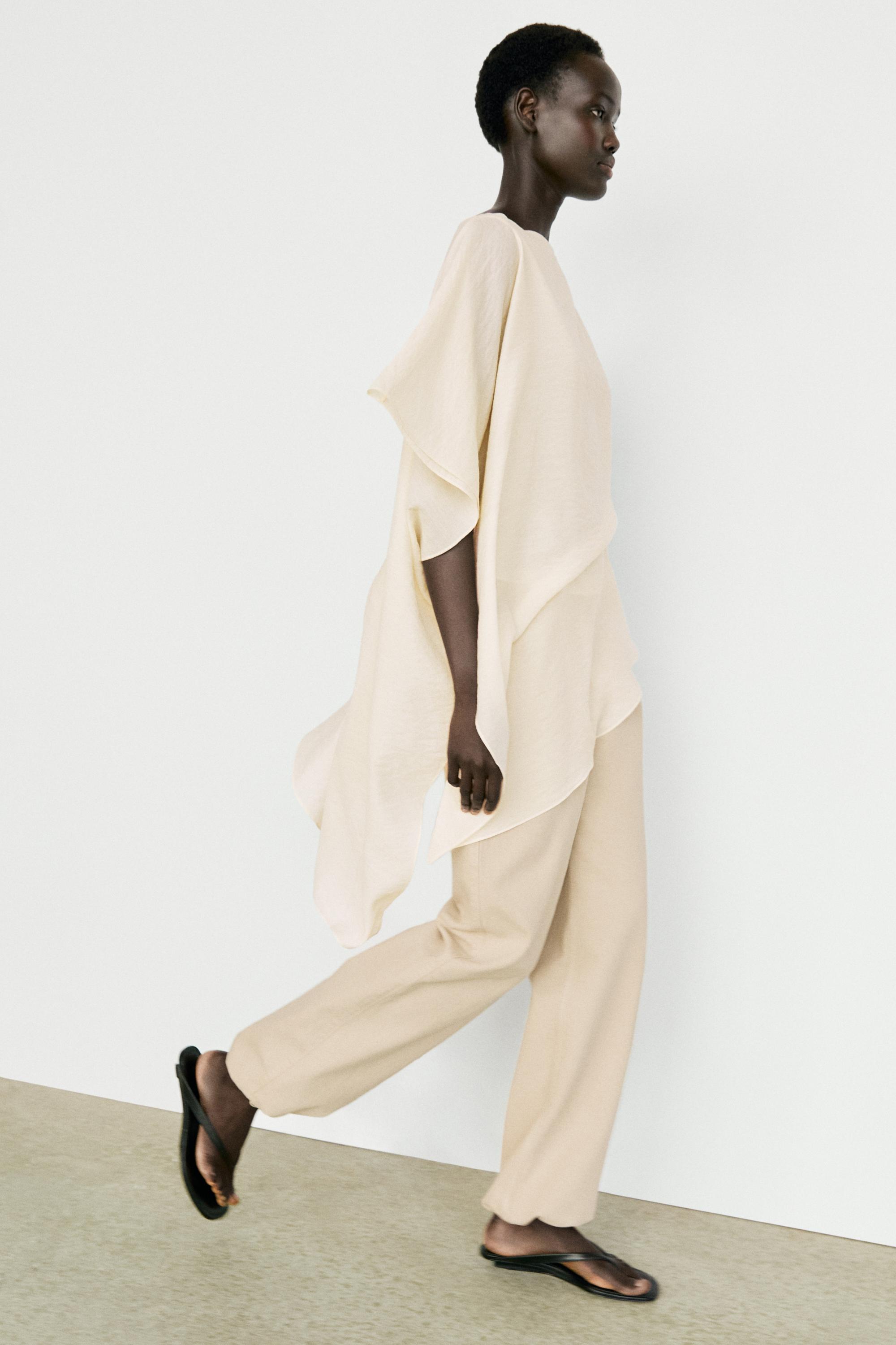 Asymmetric cape-style flowing blouse — Off white