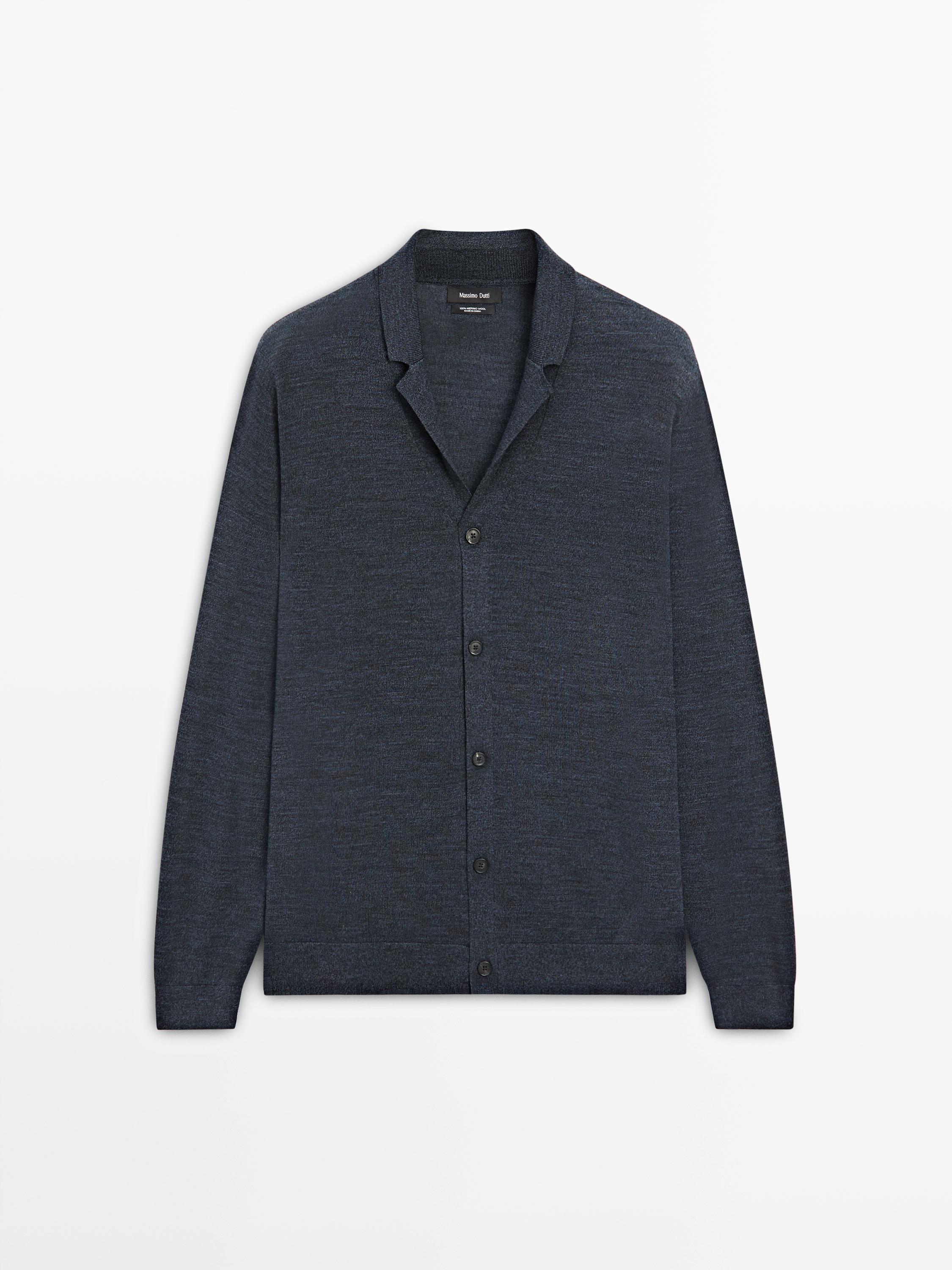 Front view of a dark navy cardigan with a lapel collar and central button closure.