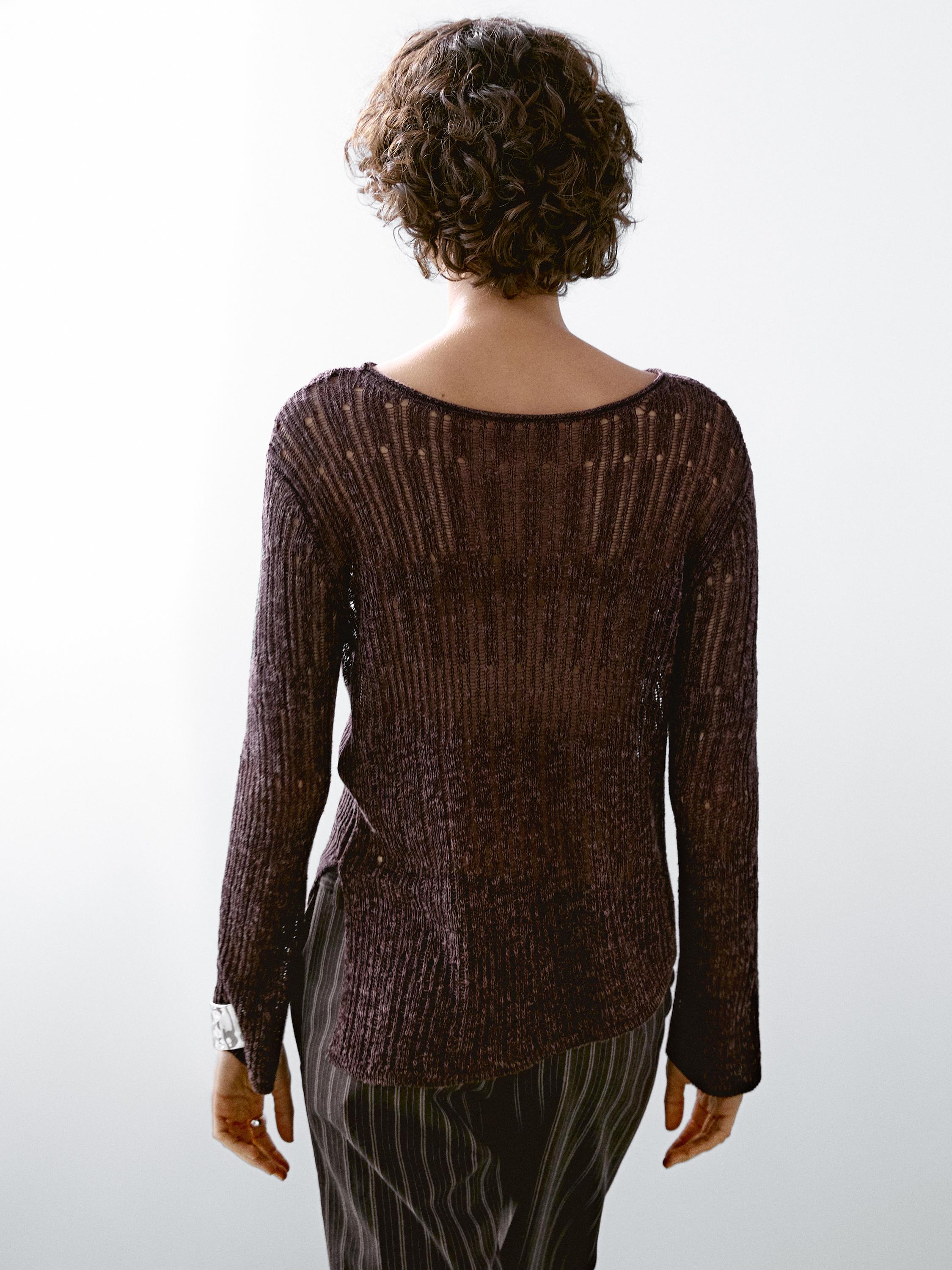 Asymmetric cutwork sweater