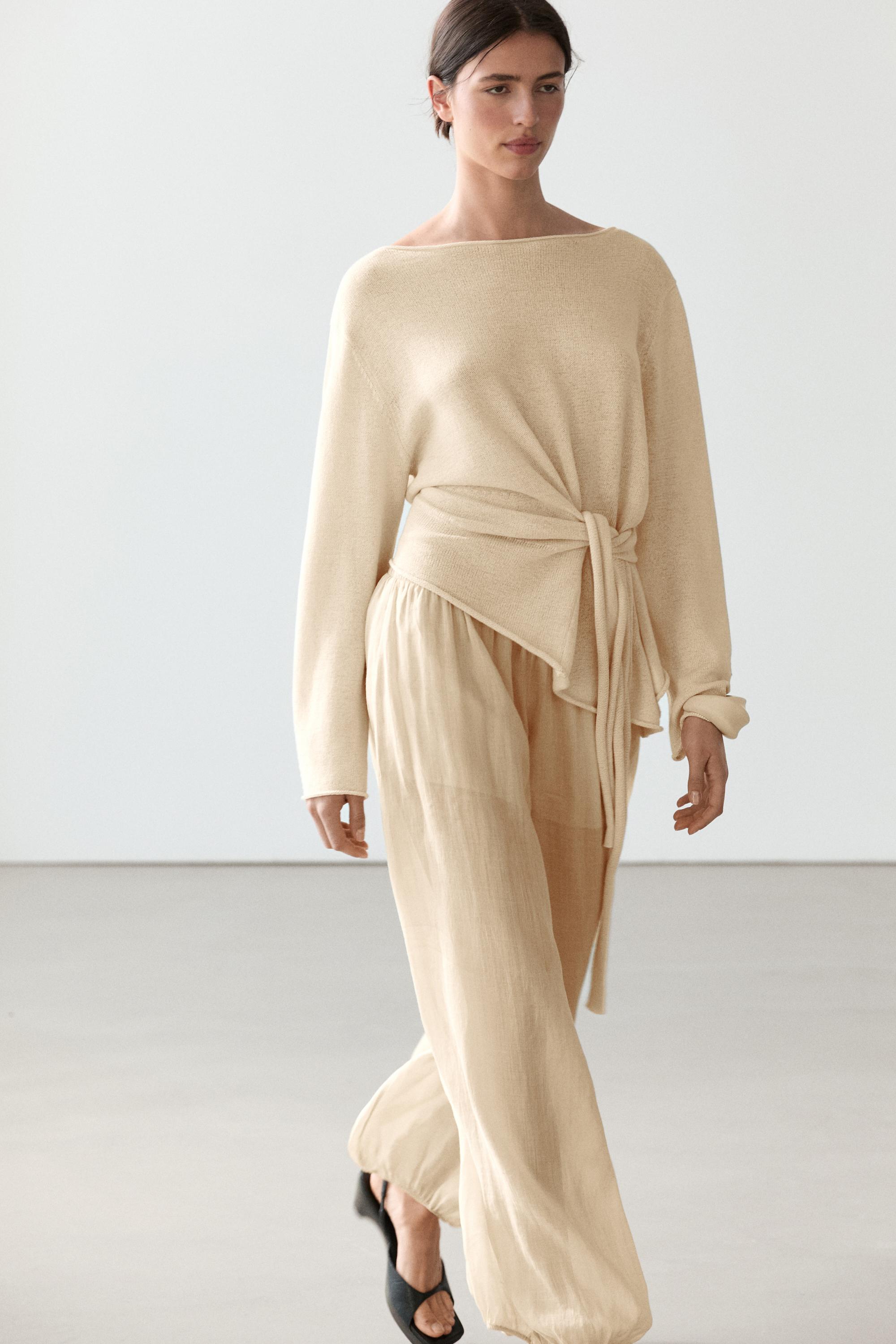 Jersei asimètric detall llaçada amb lli