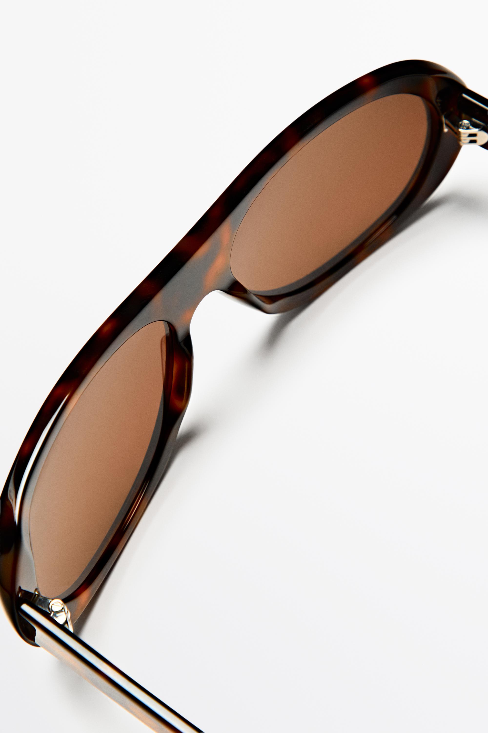 Oval tortoiseshell-effect sunglasses — BROWN