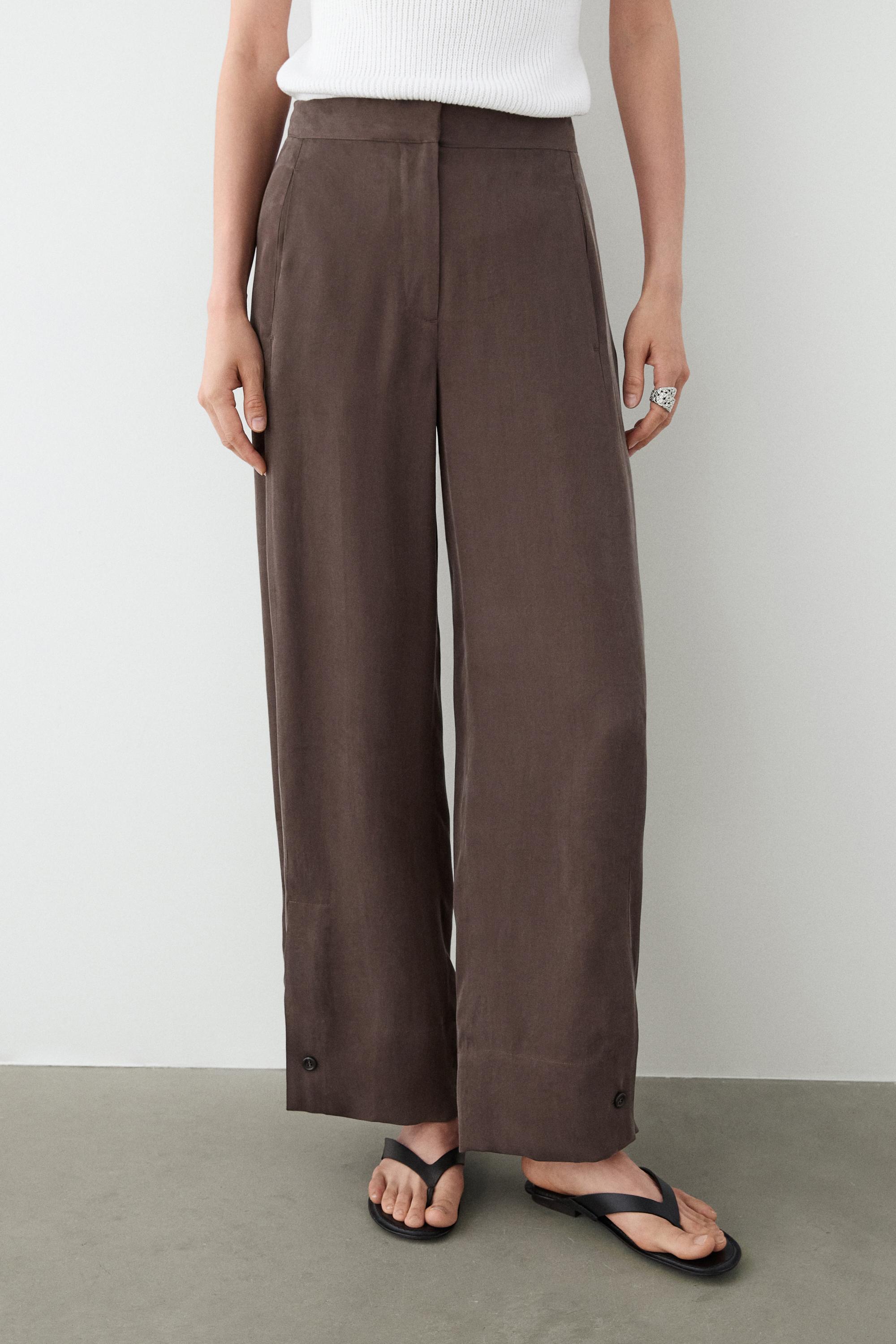 Total look flowing trousers with buttoned hems — PLUM