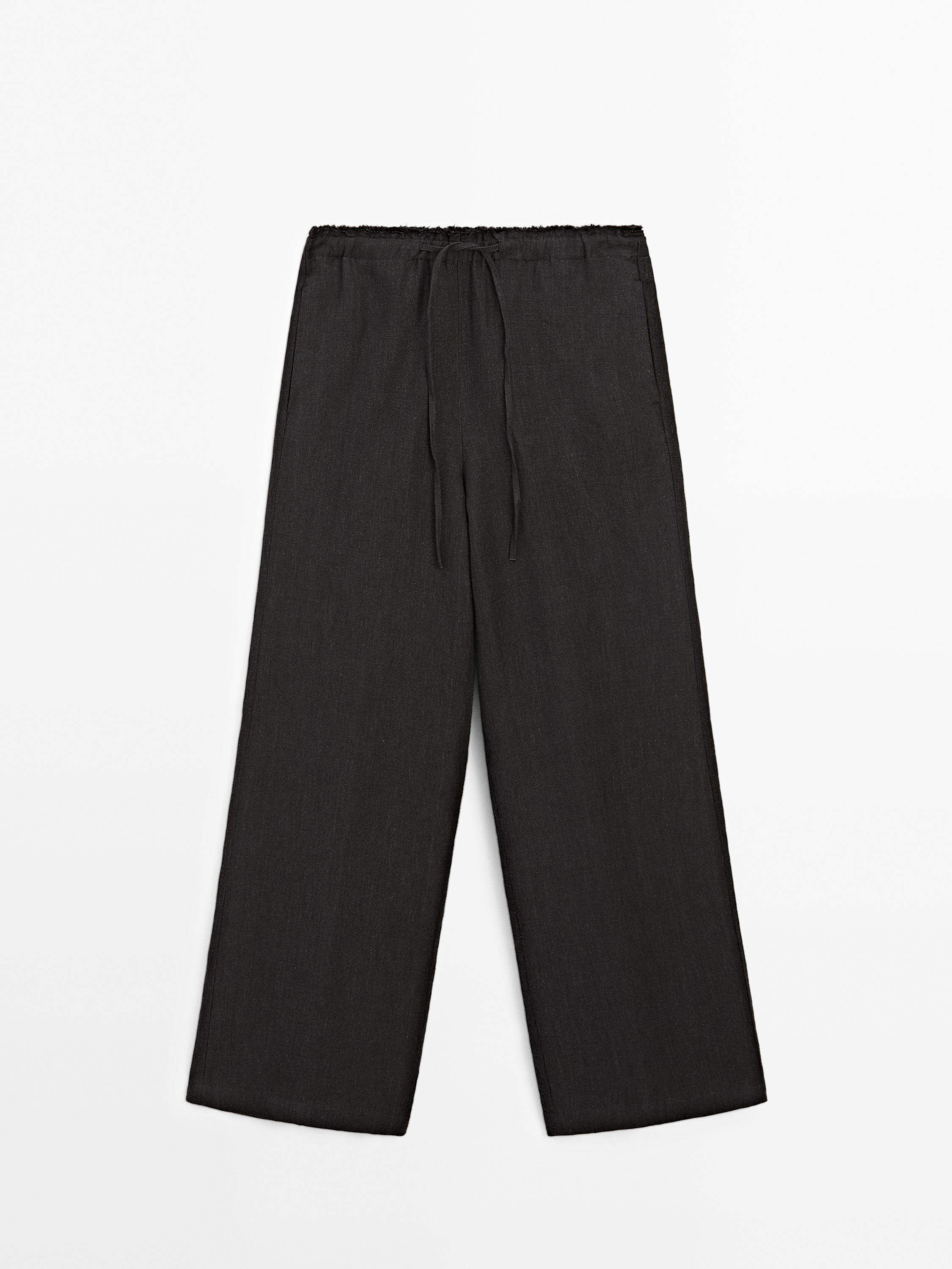 Pantalon tailleur effiloché en lin