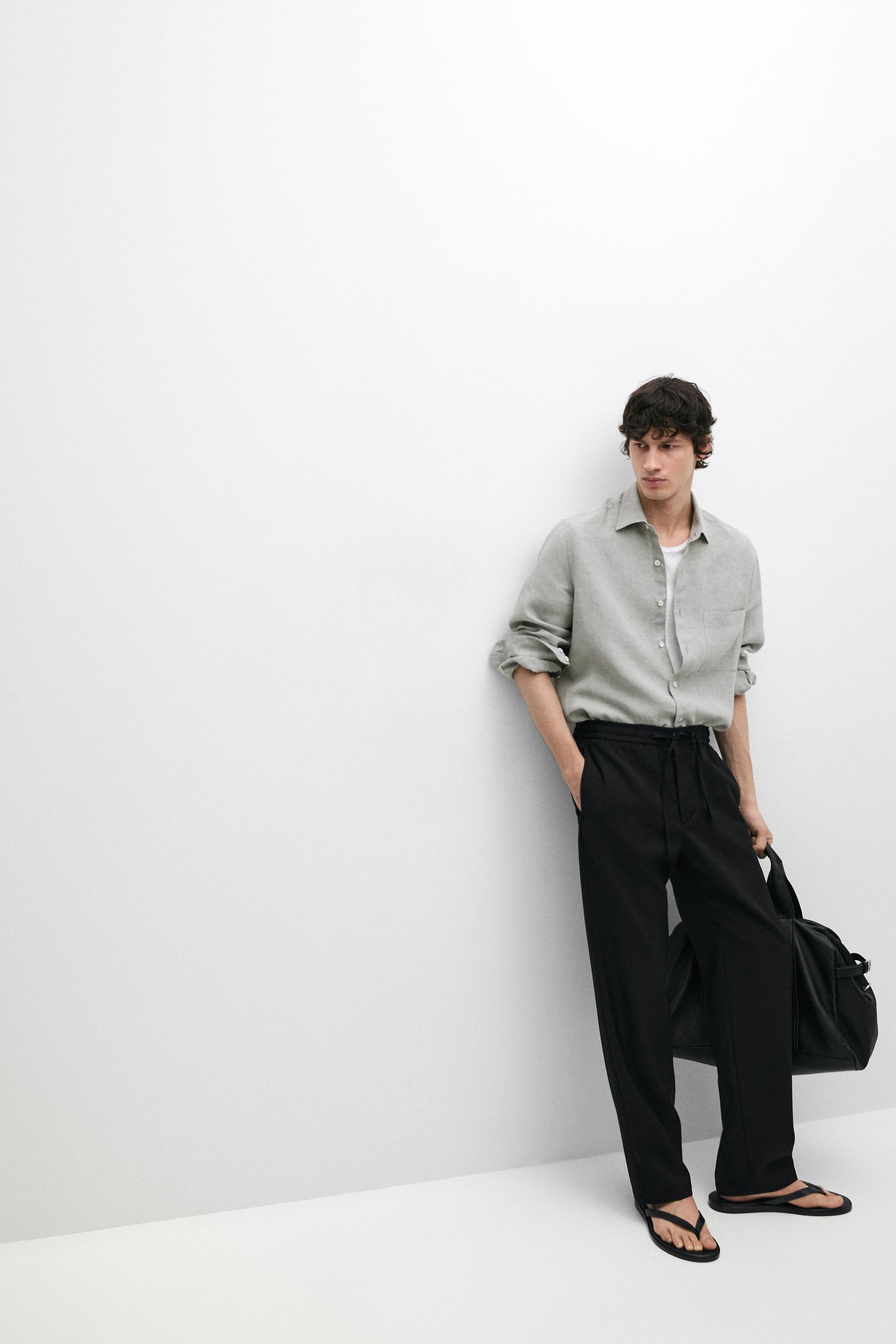 Relaxed fit 100% wool trousers — BLACK