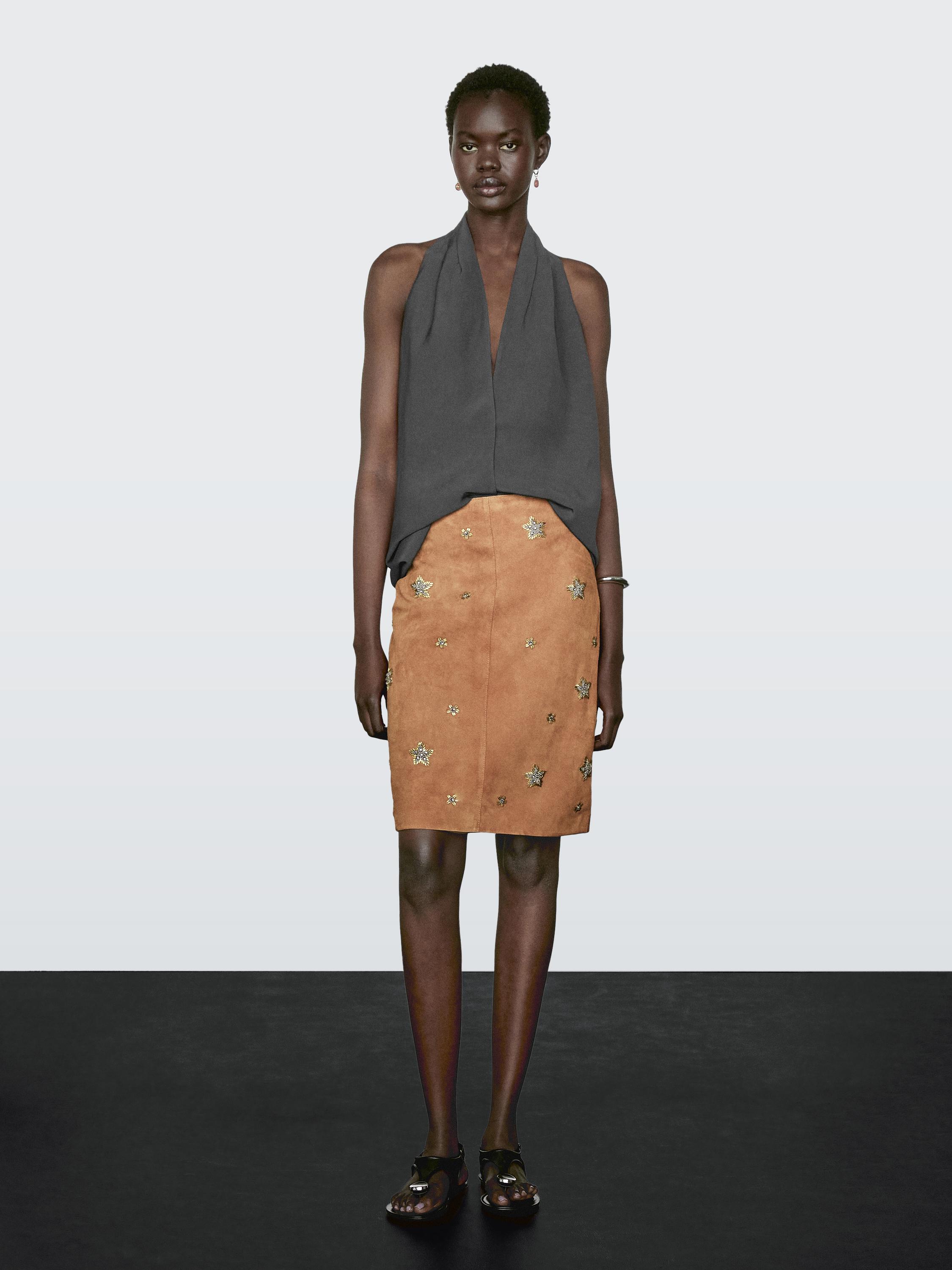 Suede leather skirt with rhinestone detail
