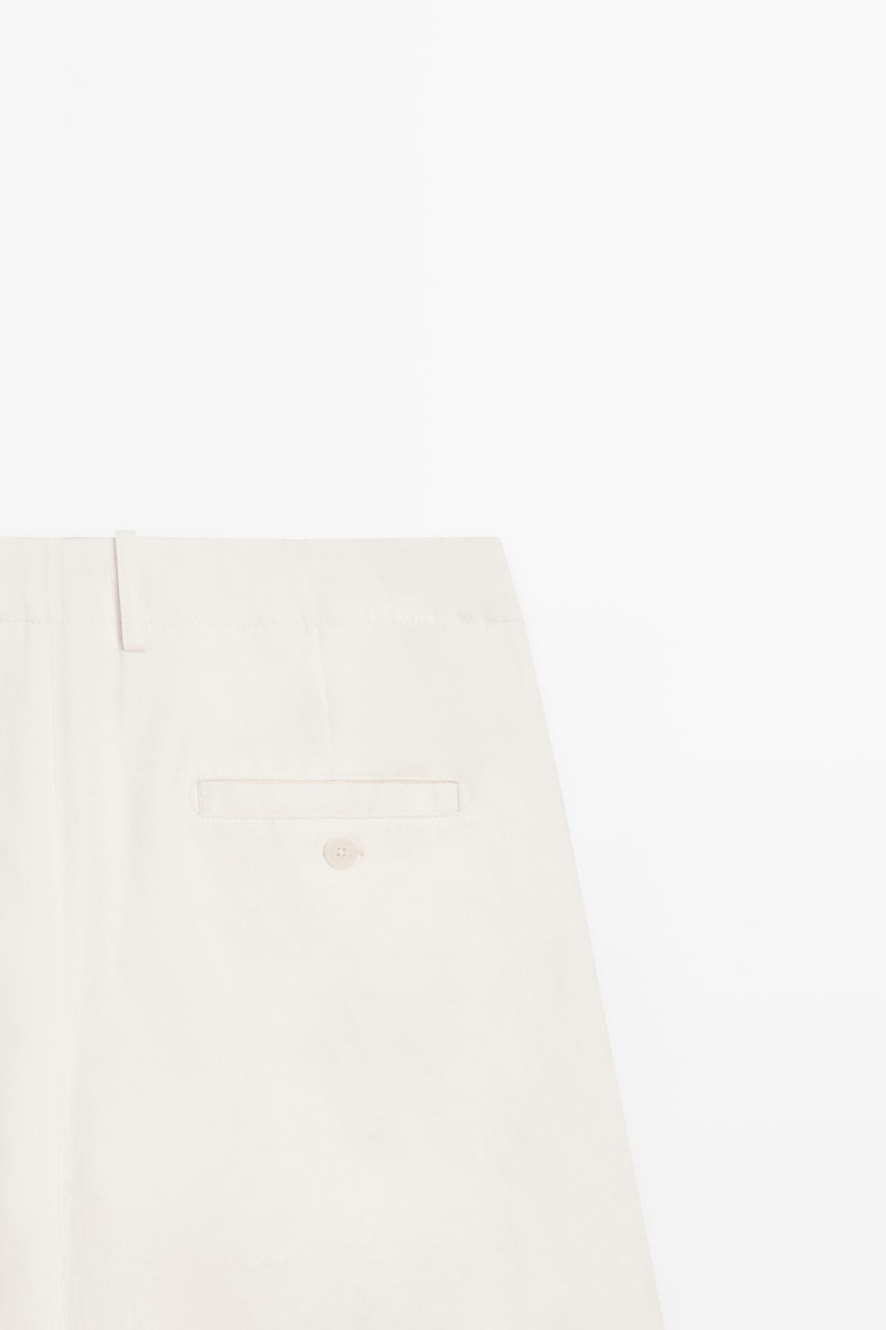 Pleated pants with crossover fastening detail - STUDIO — CREAM