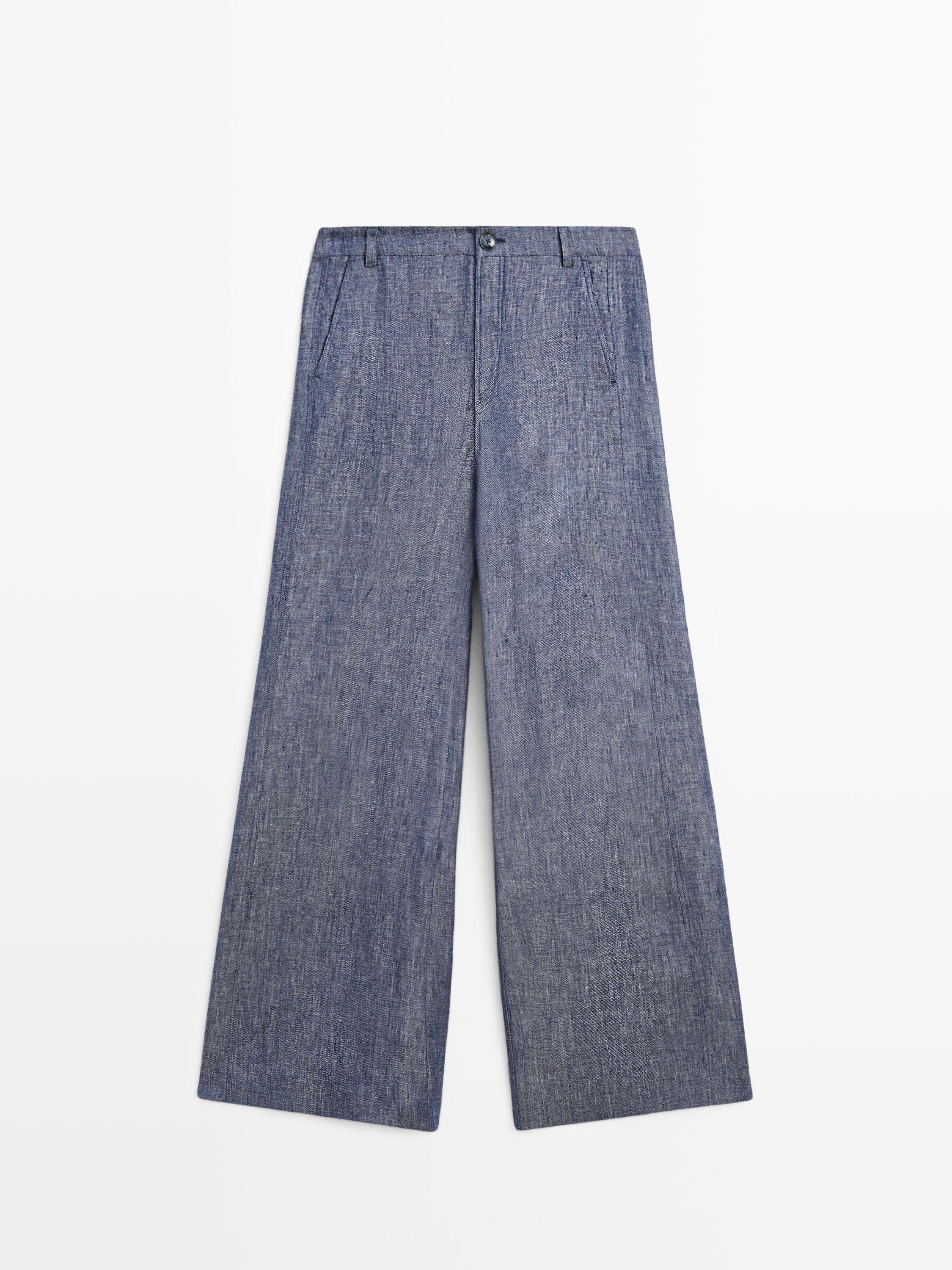 Front view of dark blue palazzo pants, high-waisted, with side pockets and button closure.