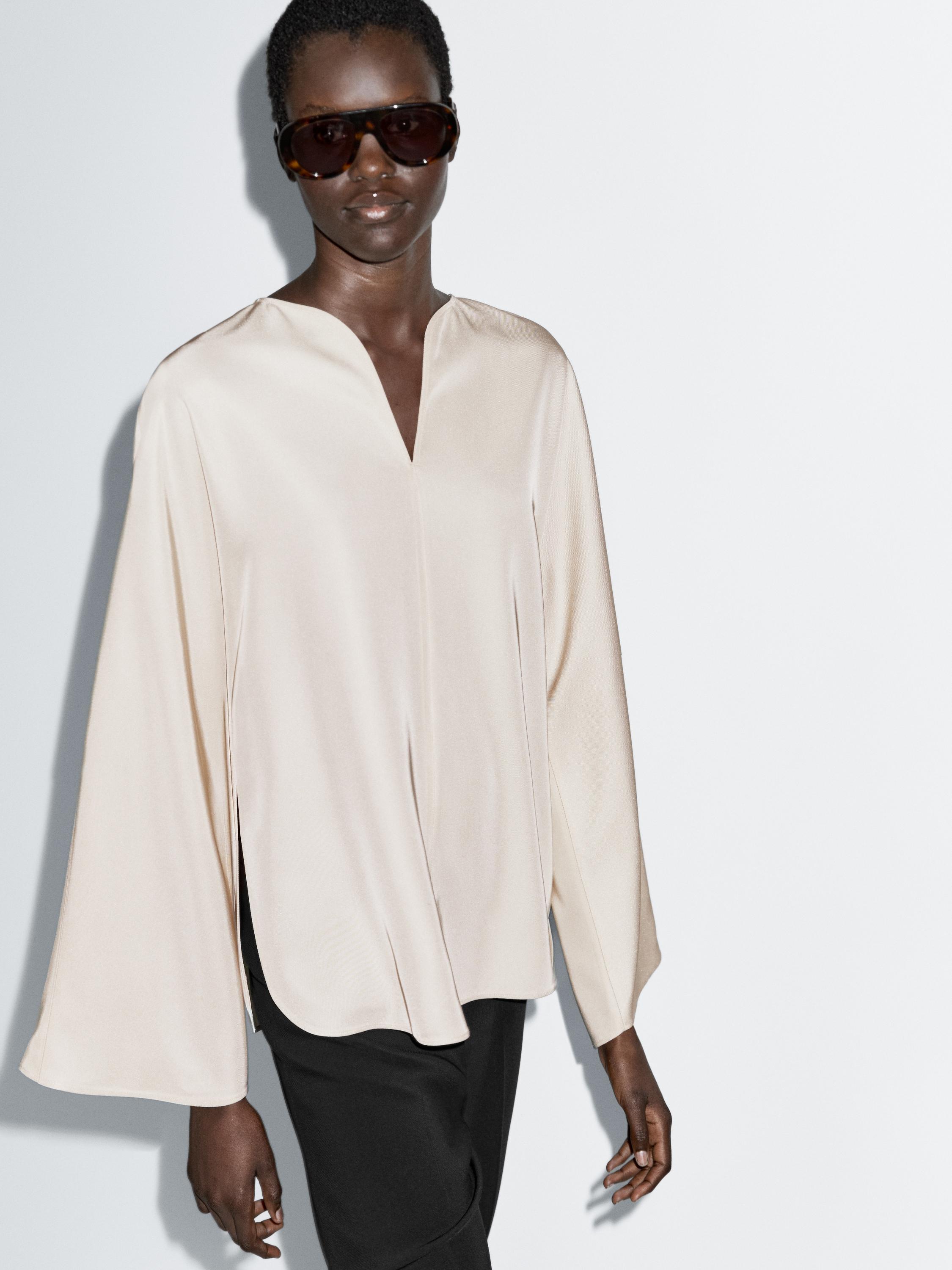 Blusa fluida detalle aberturas