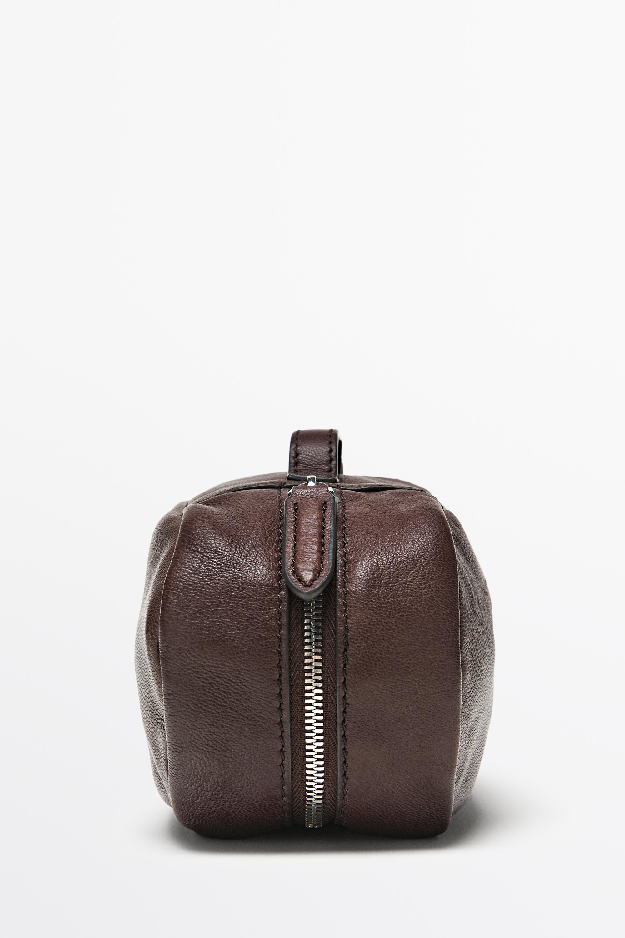 Oval nappa leather toiletry bag — BROWN