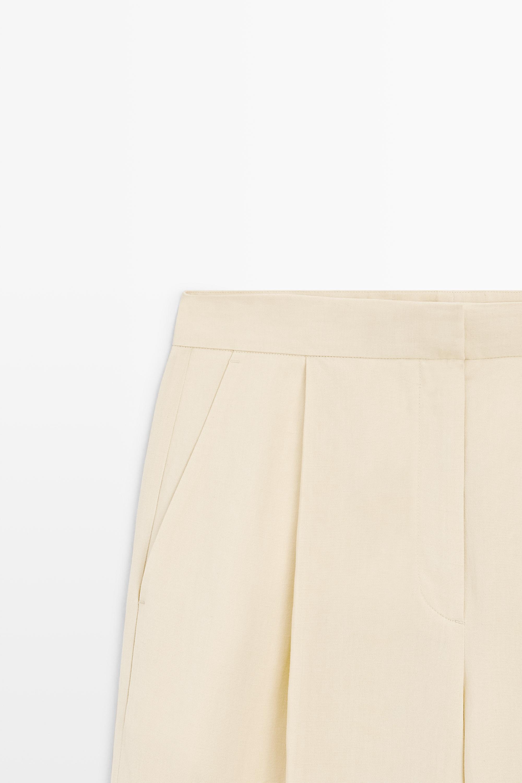 Flowing trousers with pleats — Beige