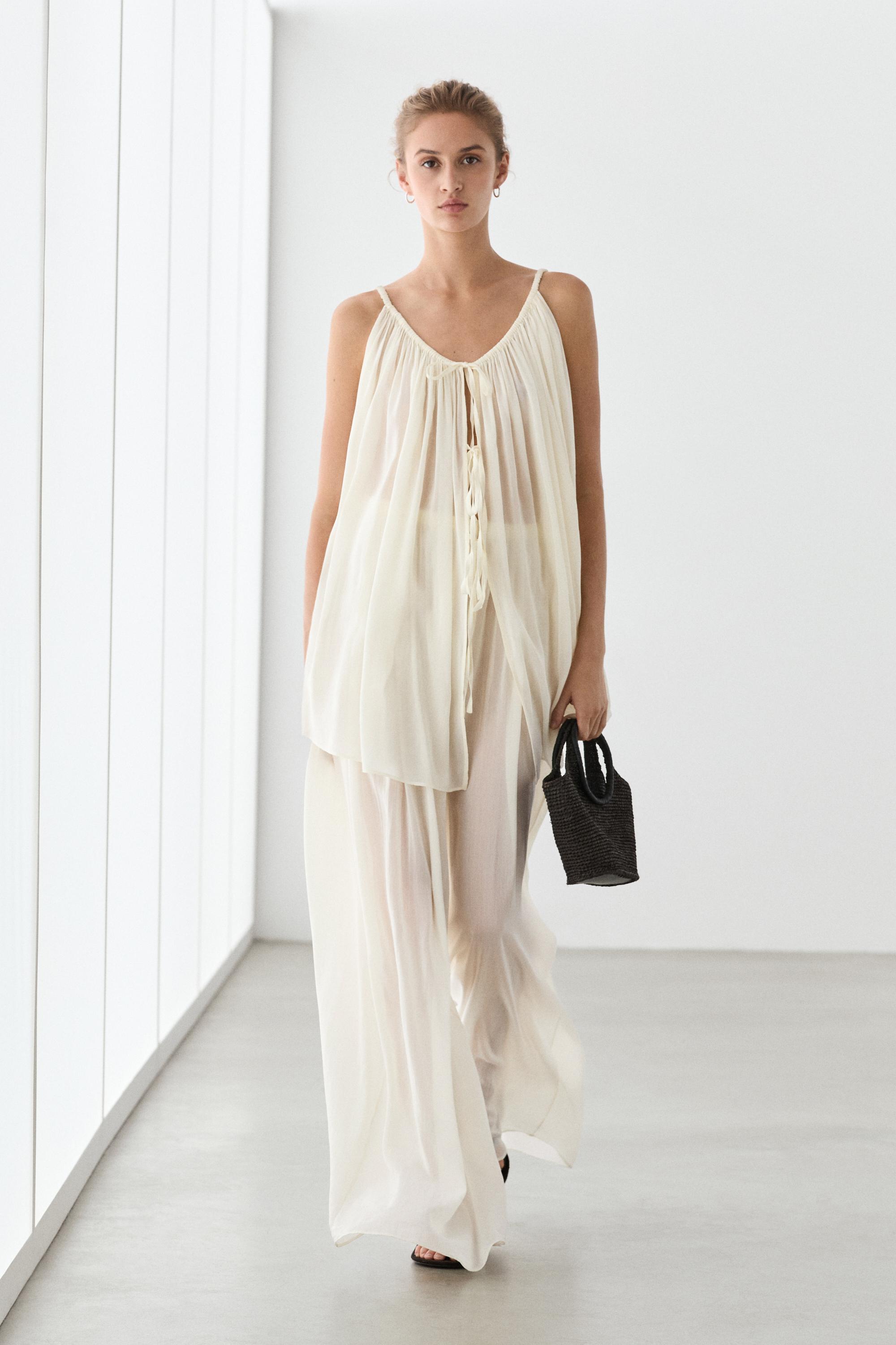 Semi-sheer flowing wide-leg pants — Off white