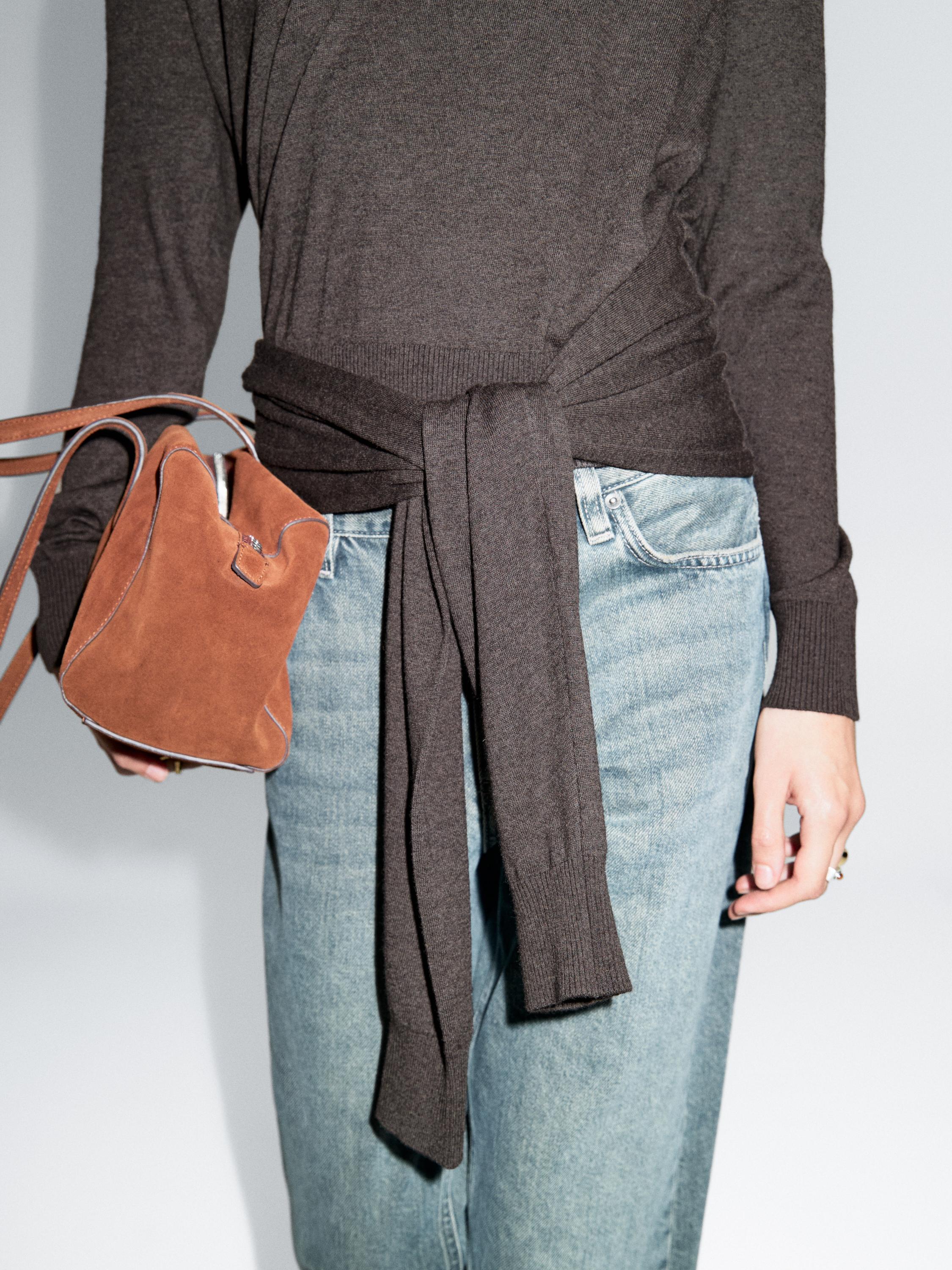 Knit sweater with multiway sleeves