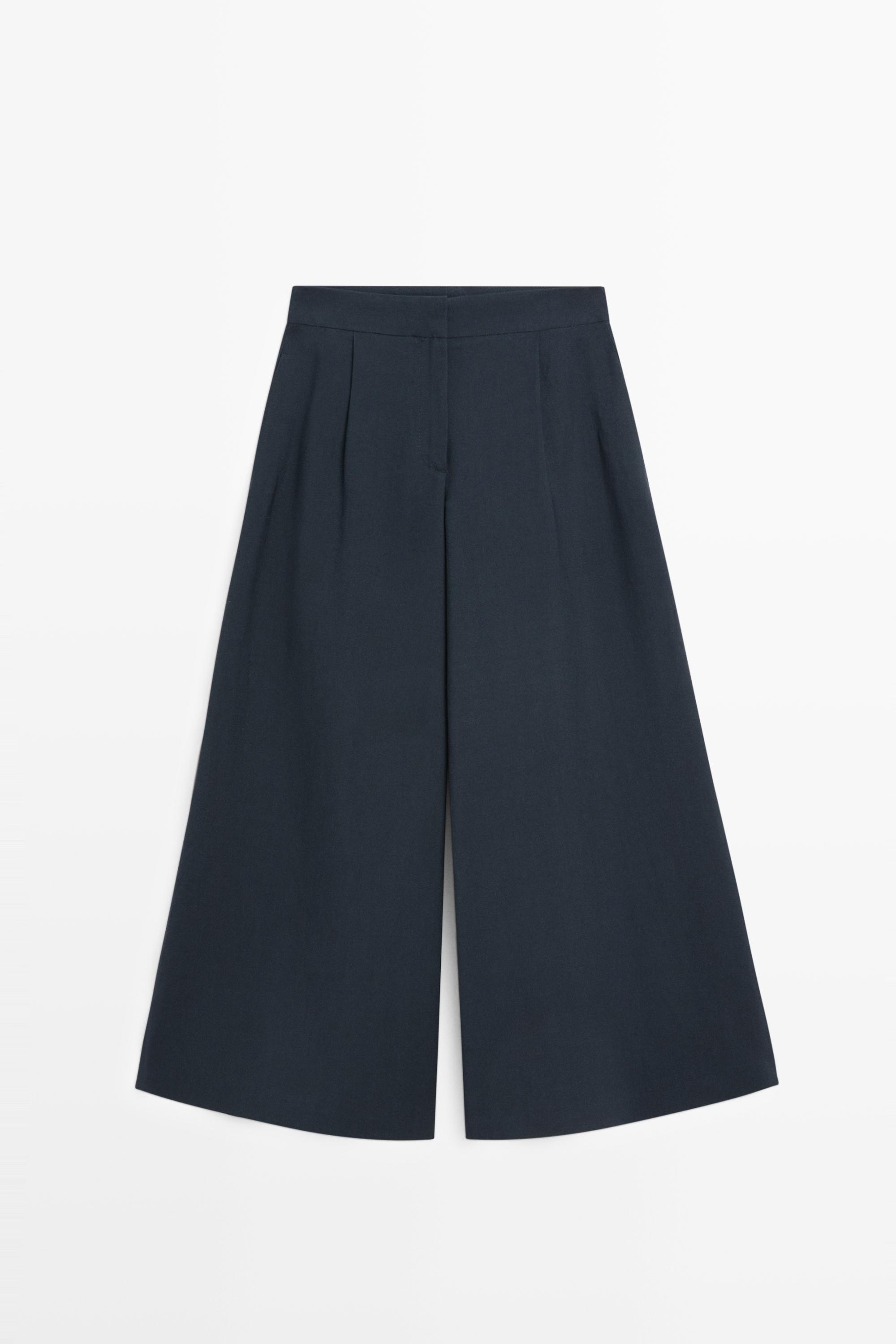 Pantalón ancho fluido pliegues