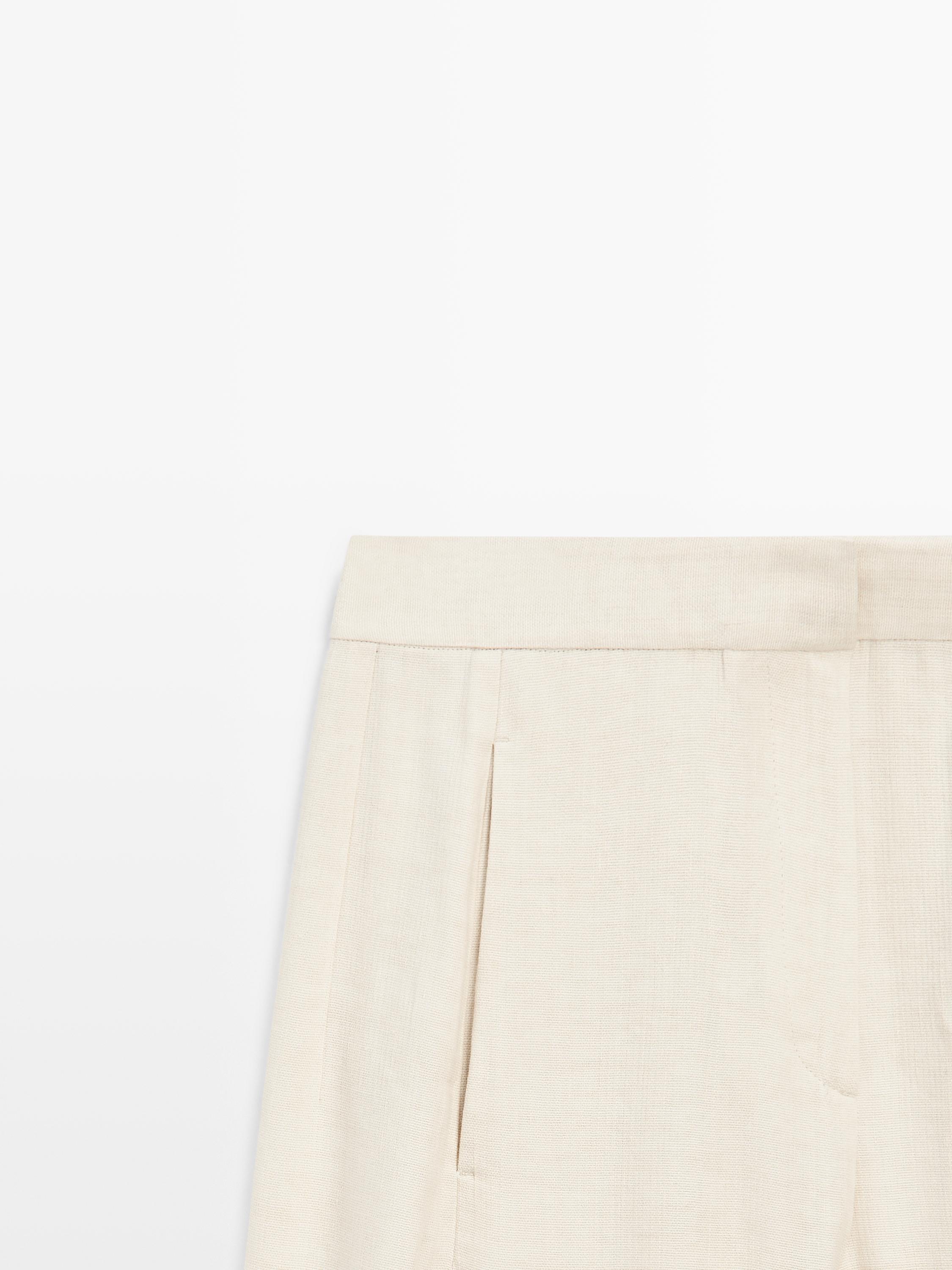 Linen blend suit trousers with button detail — CREAM