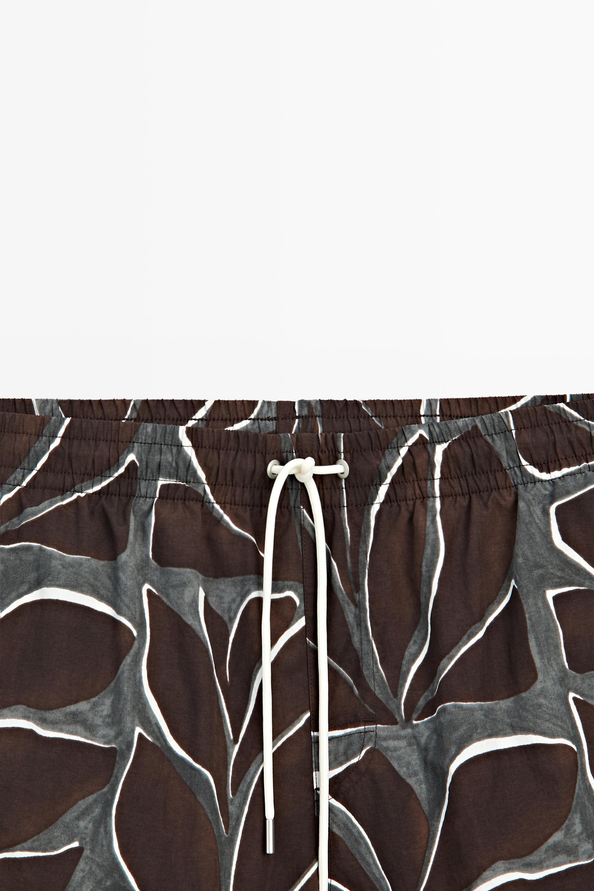Tropical print swimming trunks — Chocolate
