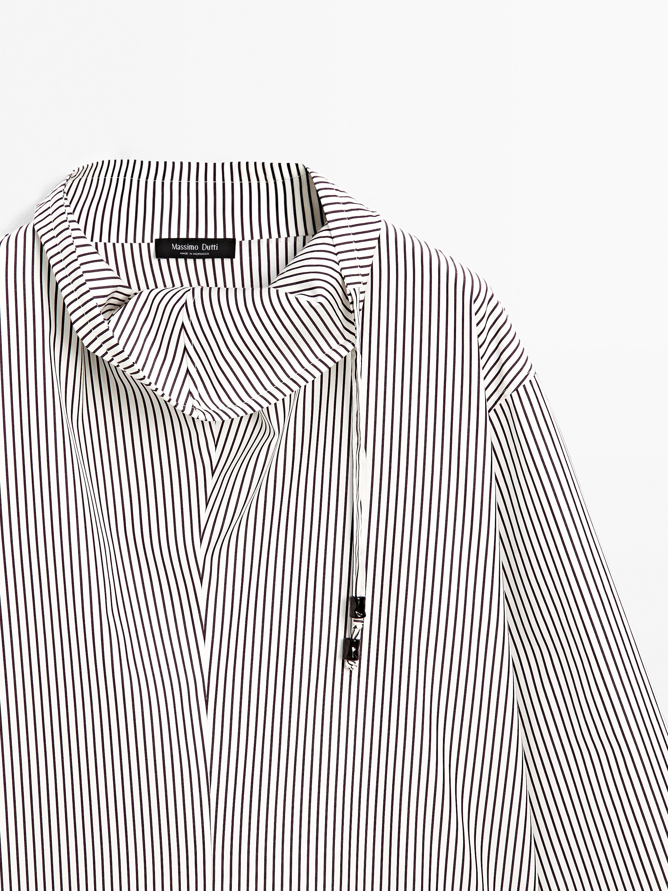 Blouse with neckline drawstring and appliqué