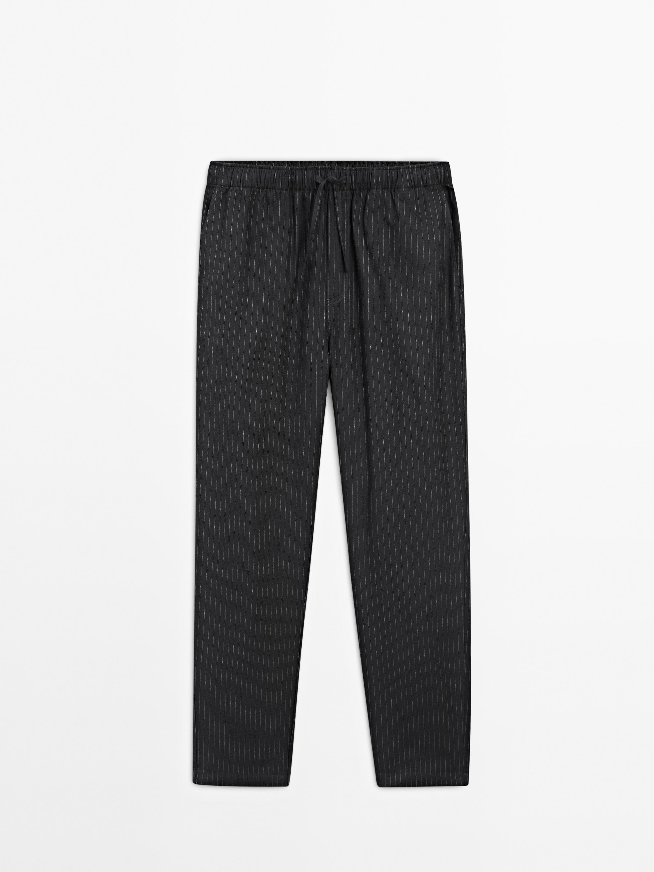 Short sleeve pyjama top and striped trousers