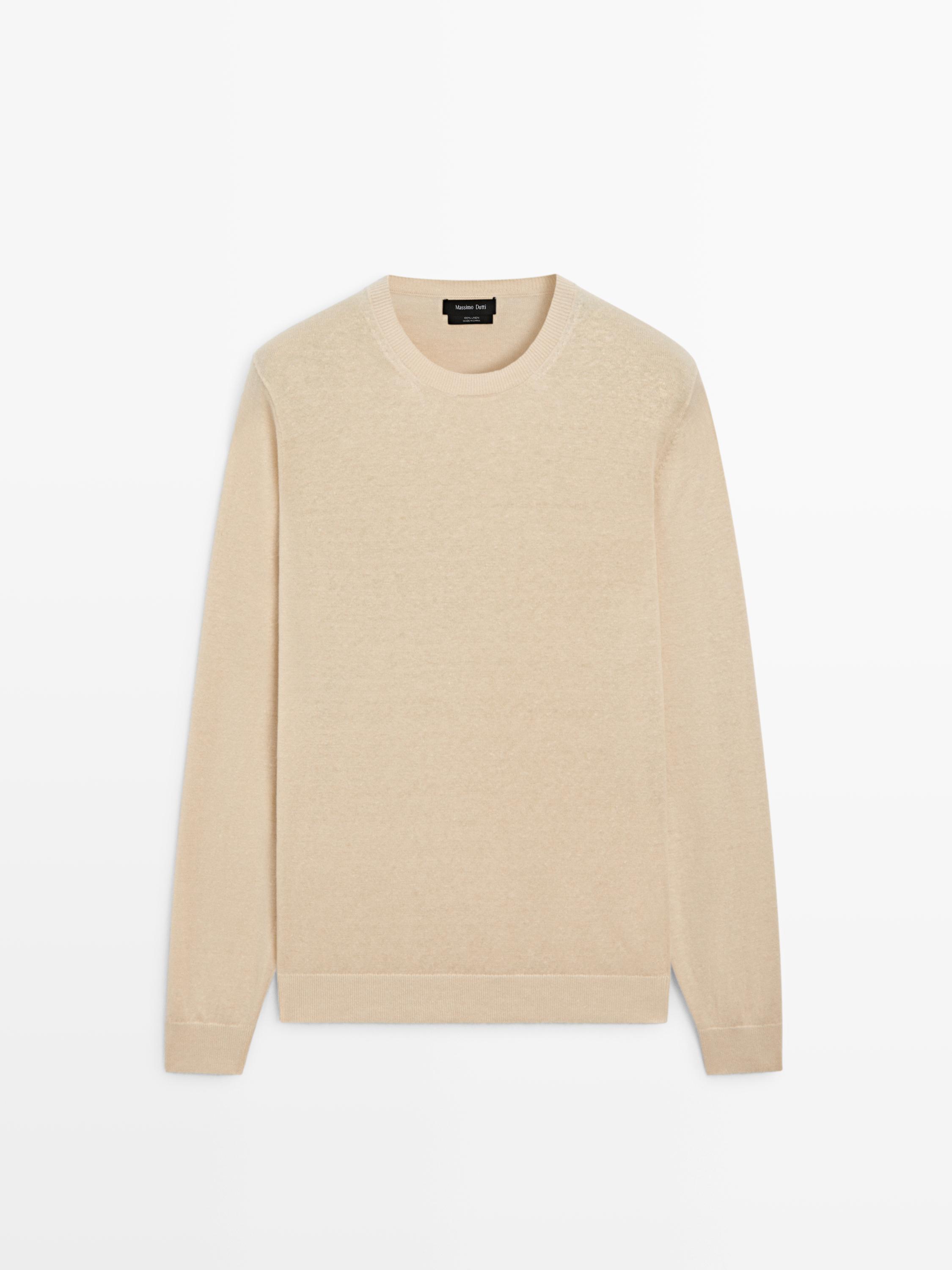 Vorderansicht eines vanillefarbenen Strickpullovers mit Rundhalsausschnitt und langen Ärmeln.