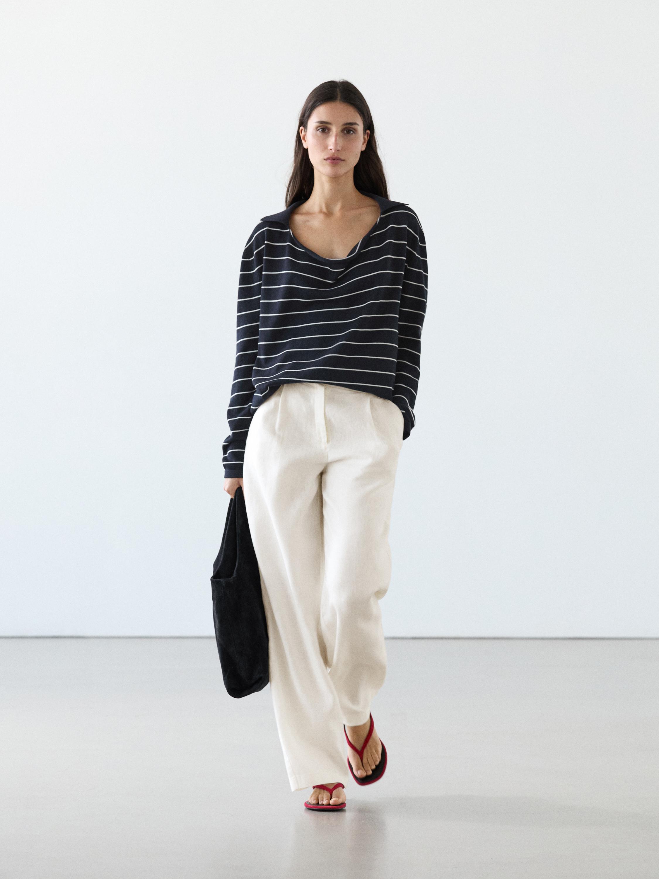 wide-leg pants and black and white striped blouse set.