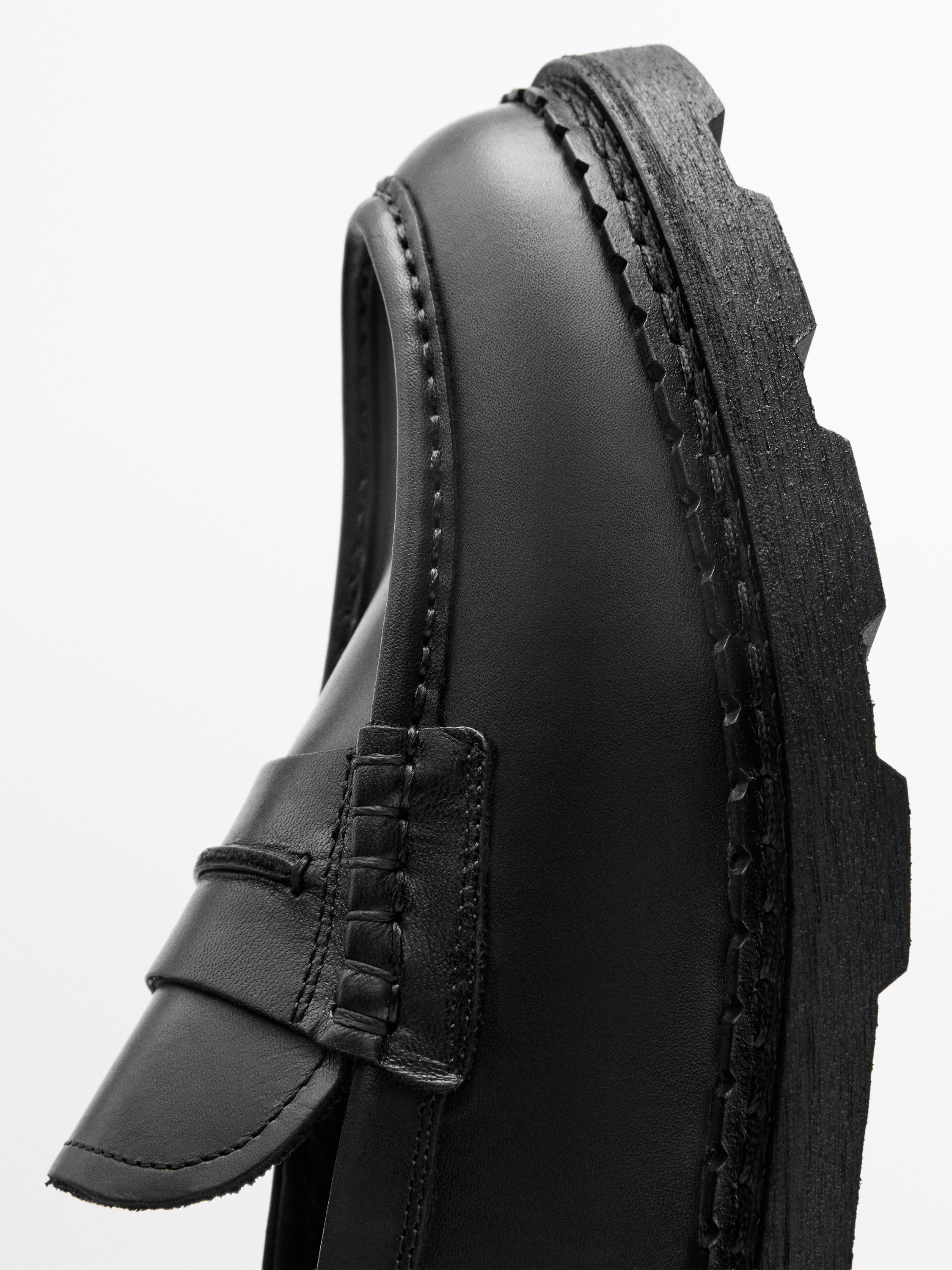 Leather track-sole loafers with penny strap — BLACK