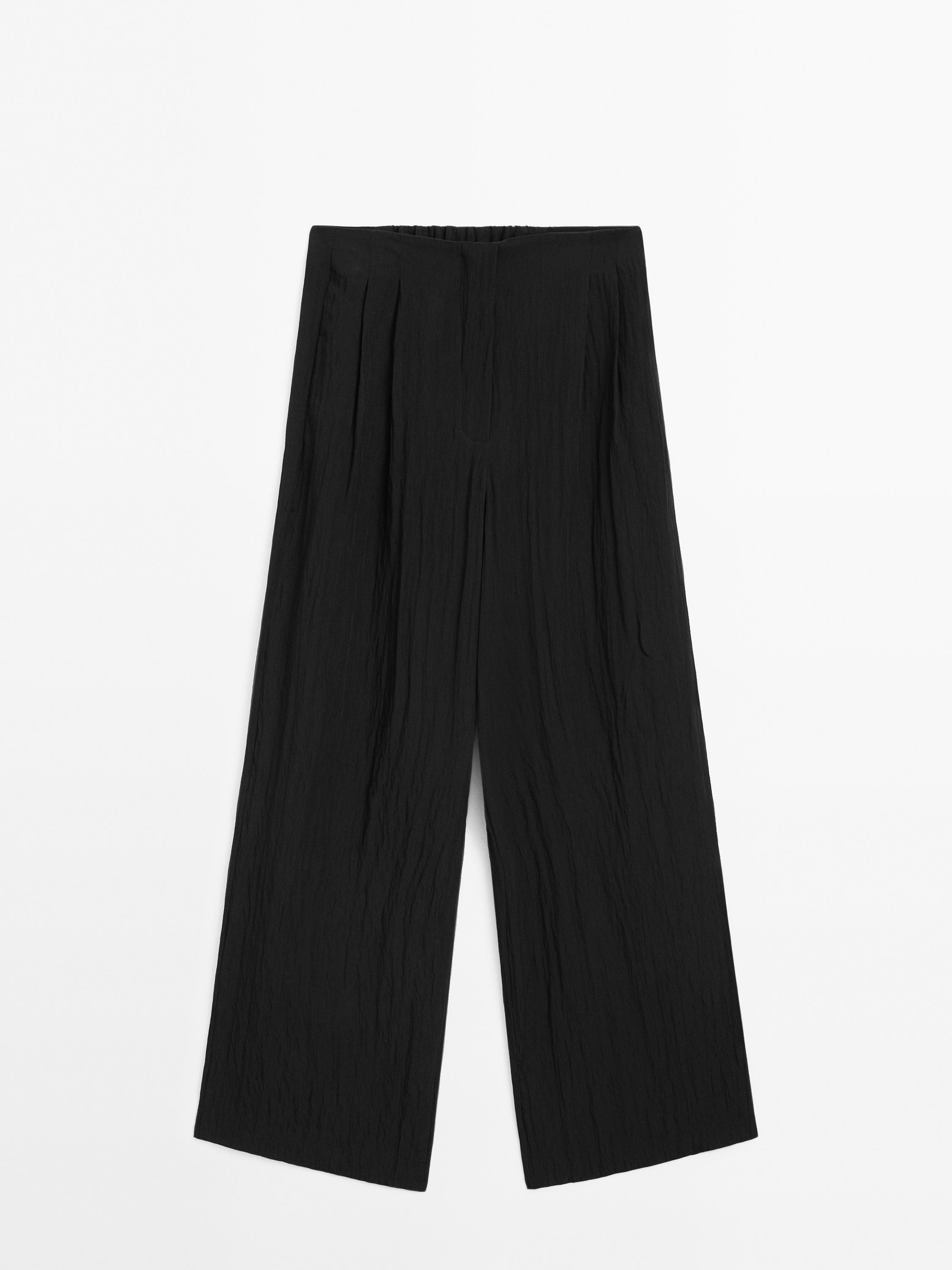 Spodnie z tkaniny technicznej z zakładkami