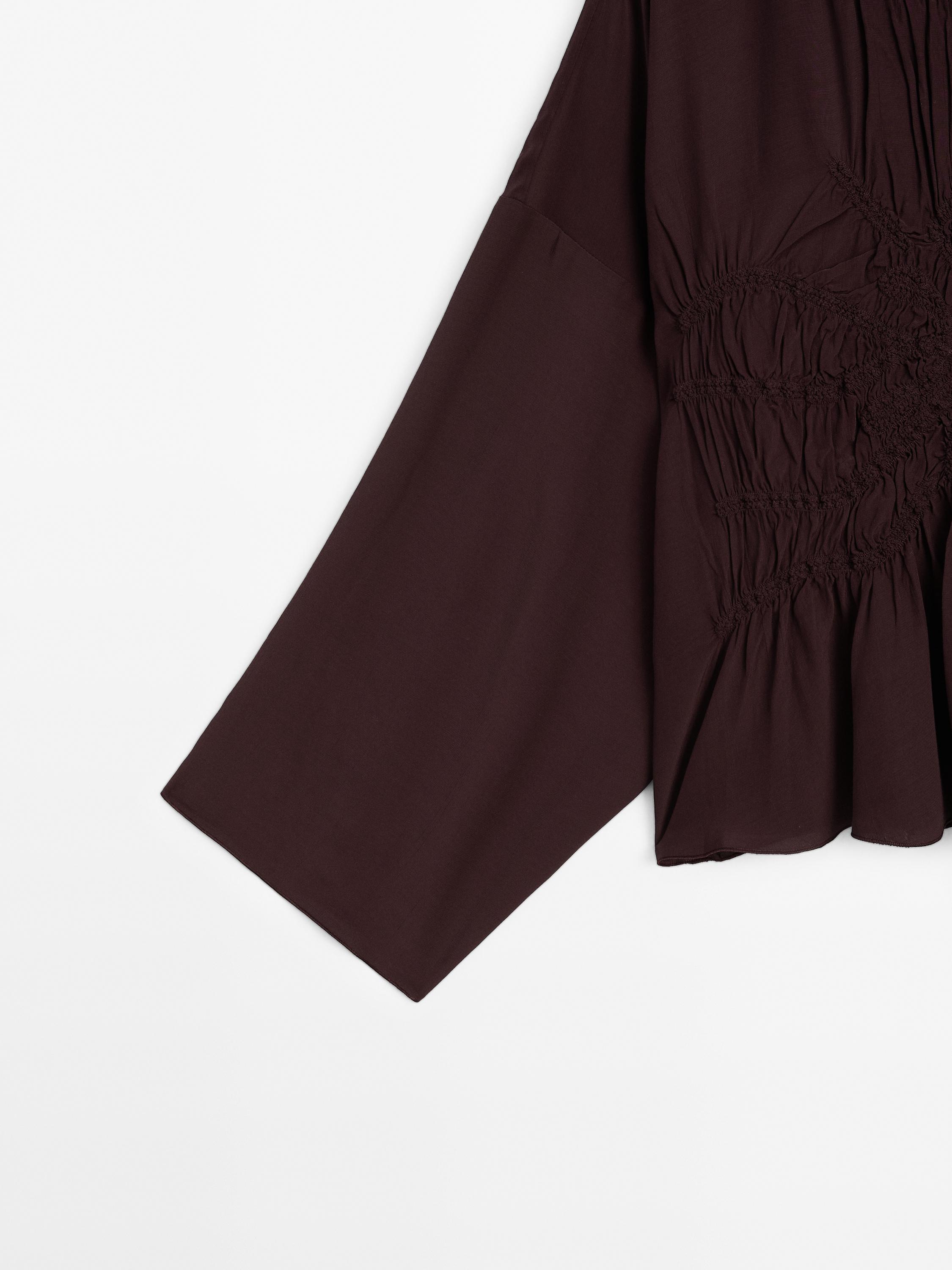Flowing blouse with gathered detail